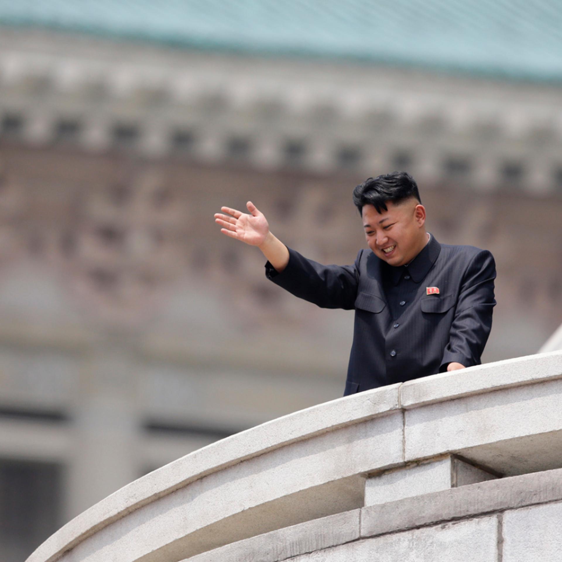 North Korean leader Kim Jong-un waves to the people during a parade to commemorate the 60th anniversary of the signing of a truce in the 1950-1953 Korean War, at Kim Il-sung Square in Pyongyang July 27, 2013.