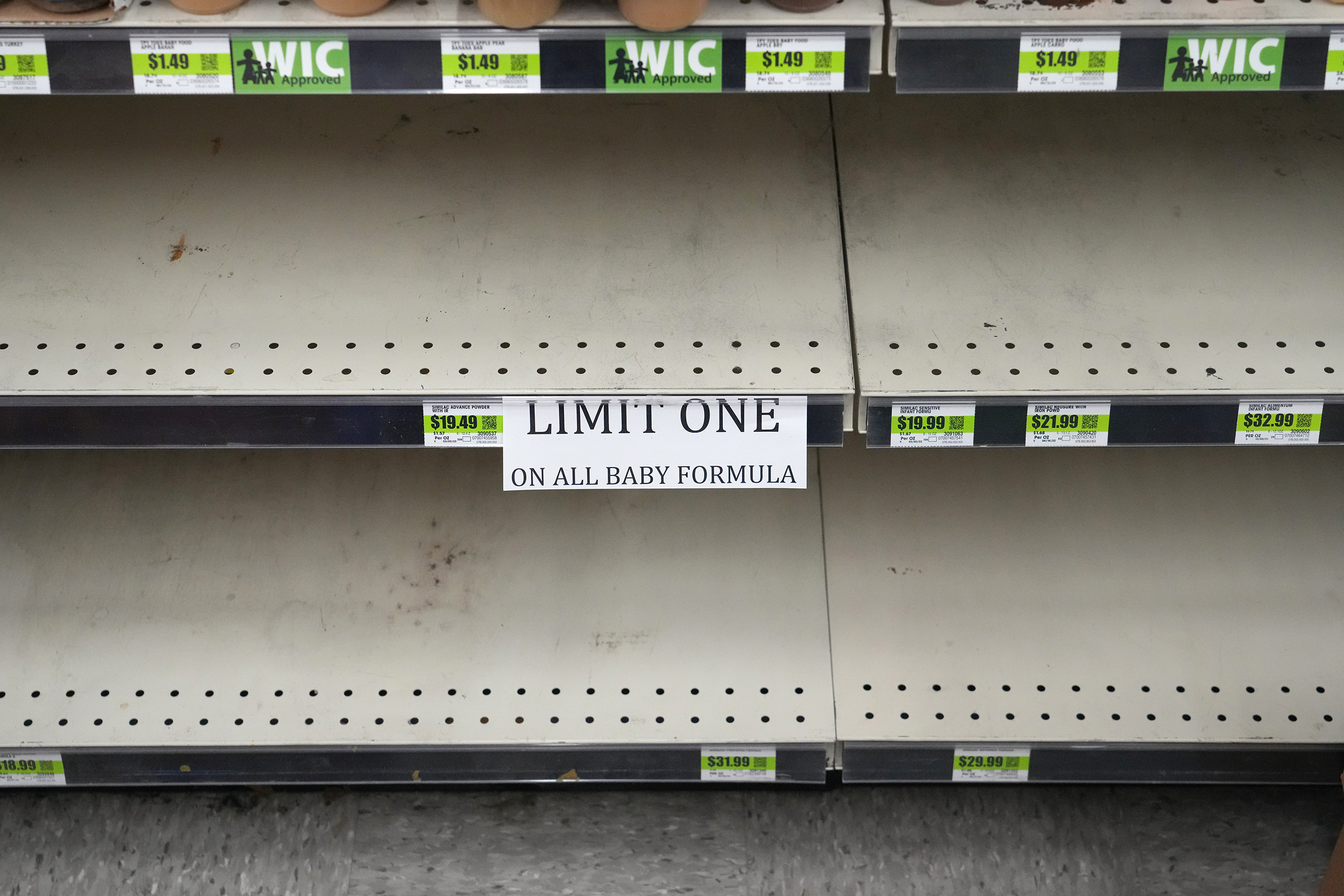 A sign in front of empty shelves notifies customers that they are allowed only one container of baby formula at a store in Provo, Utah, on May 17.