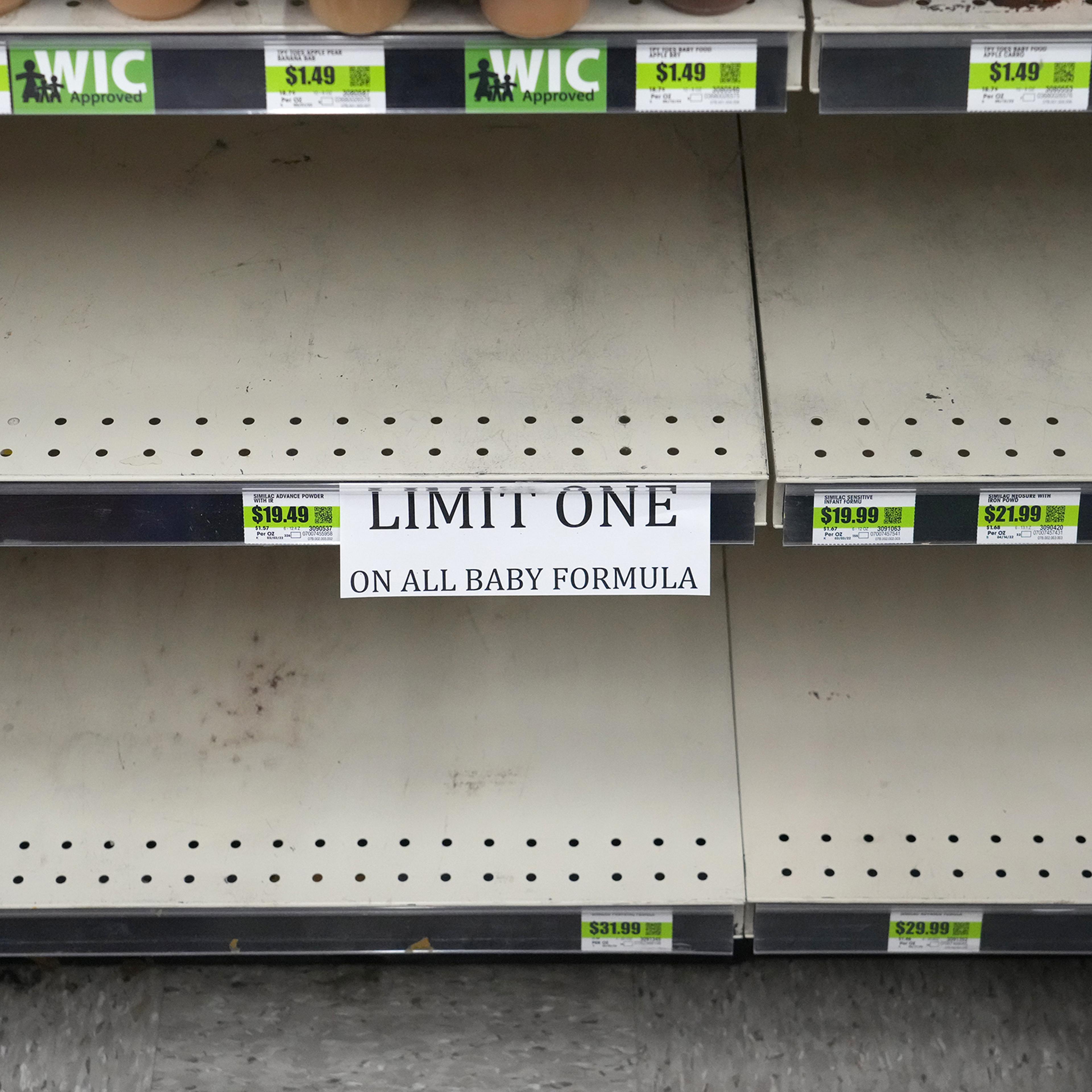 A sign in front of empty shelves notifies customers that they are allowed only one container of baby formula at a store in Provo, Utah, on May 17.