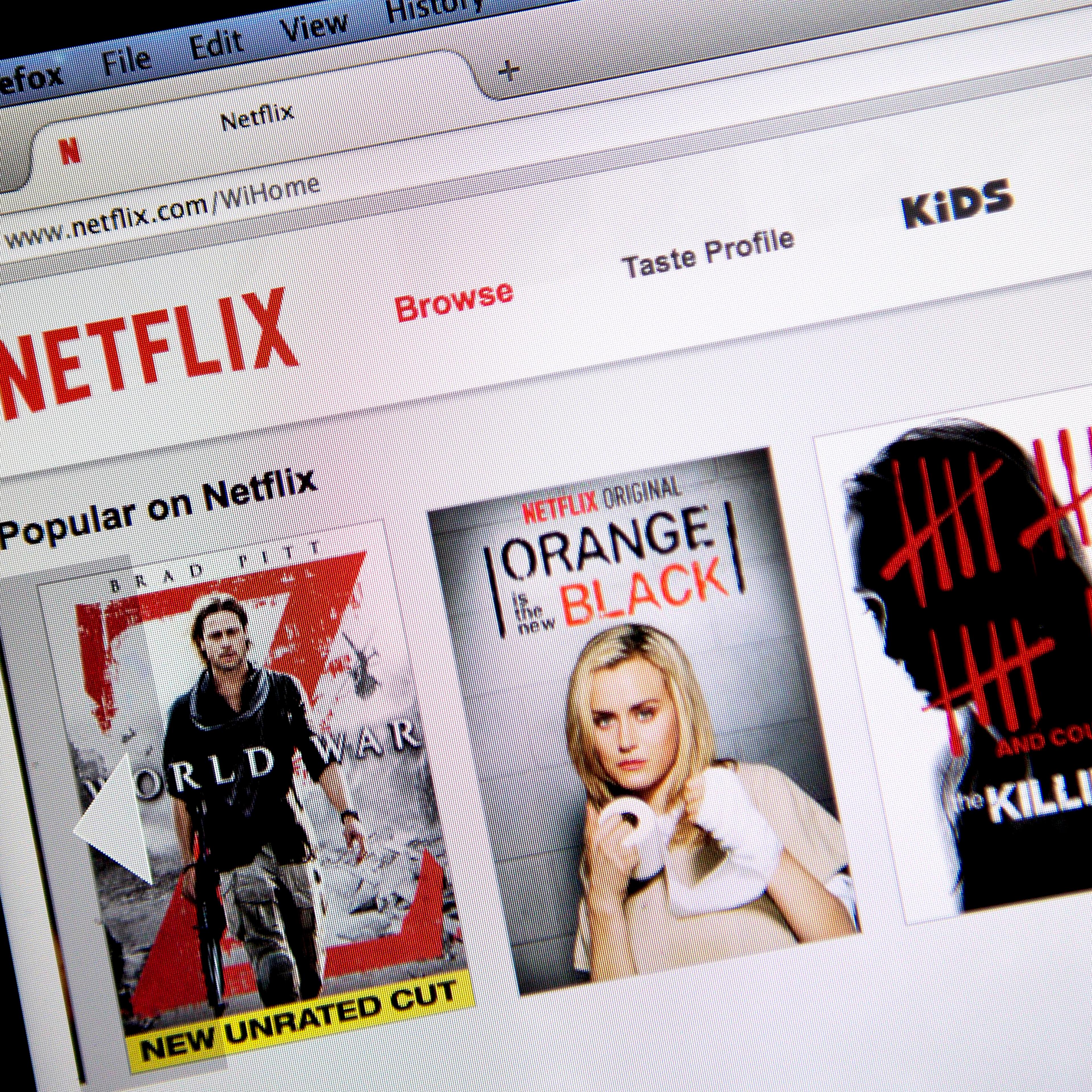 The Netflix Inc. website is displayed on a laptop computer.