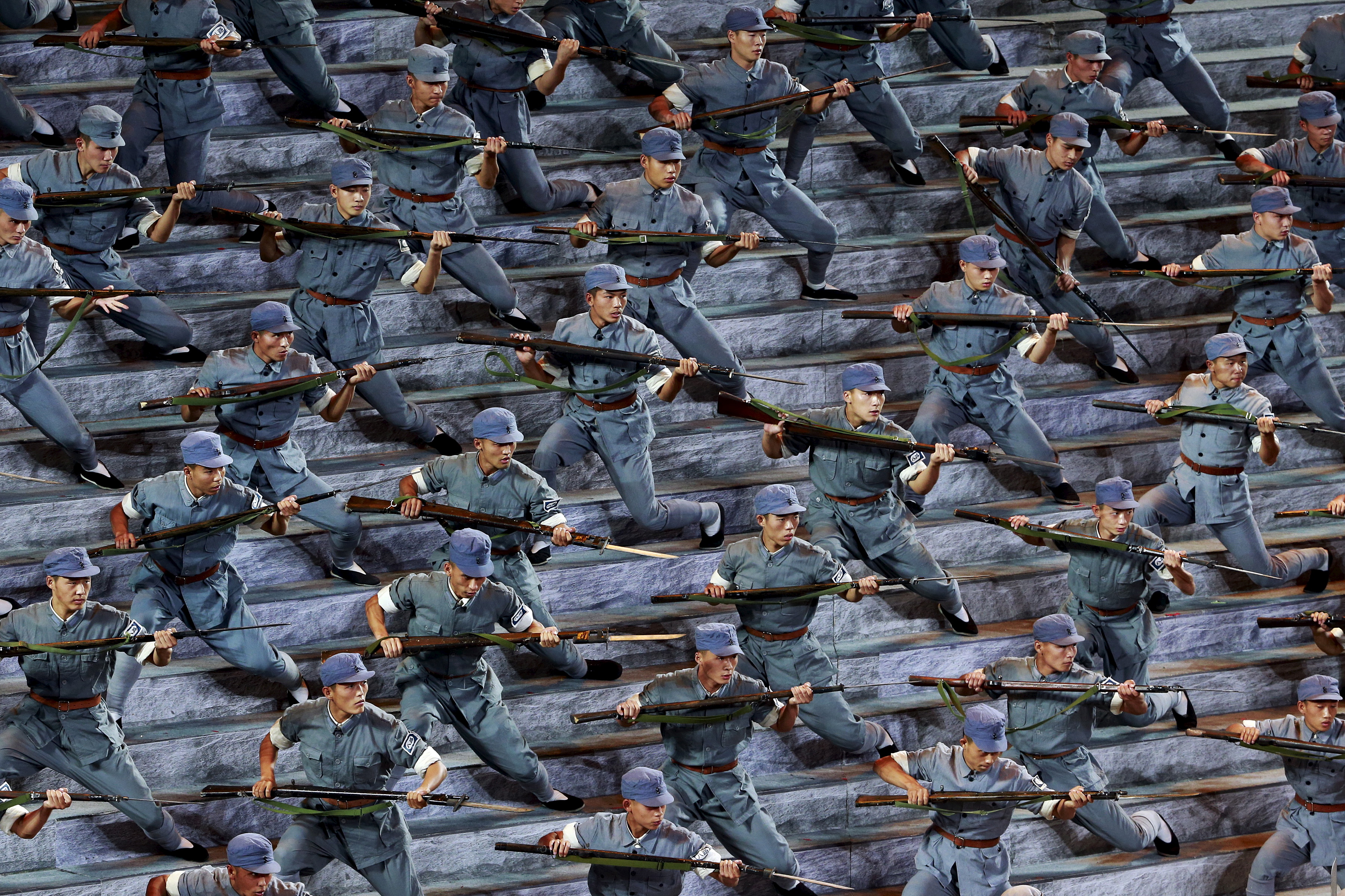 Actors dressed as Red Army soldiers perform at a gala show to mark the 70th anniversary of the end of World War Two, in Beijing