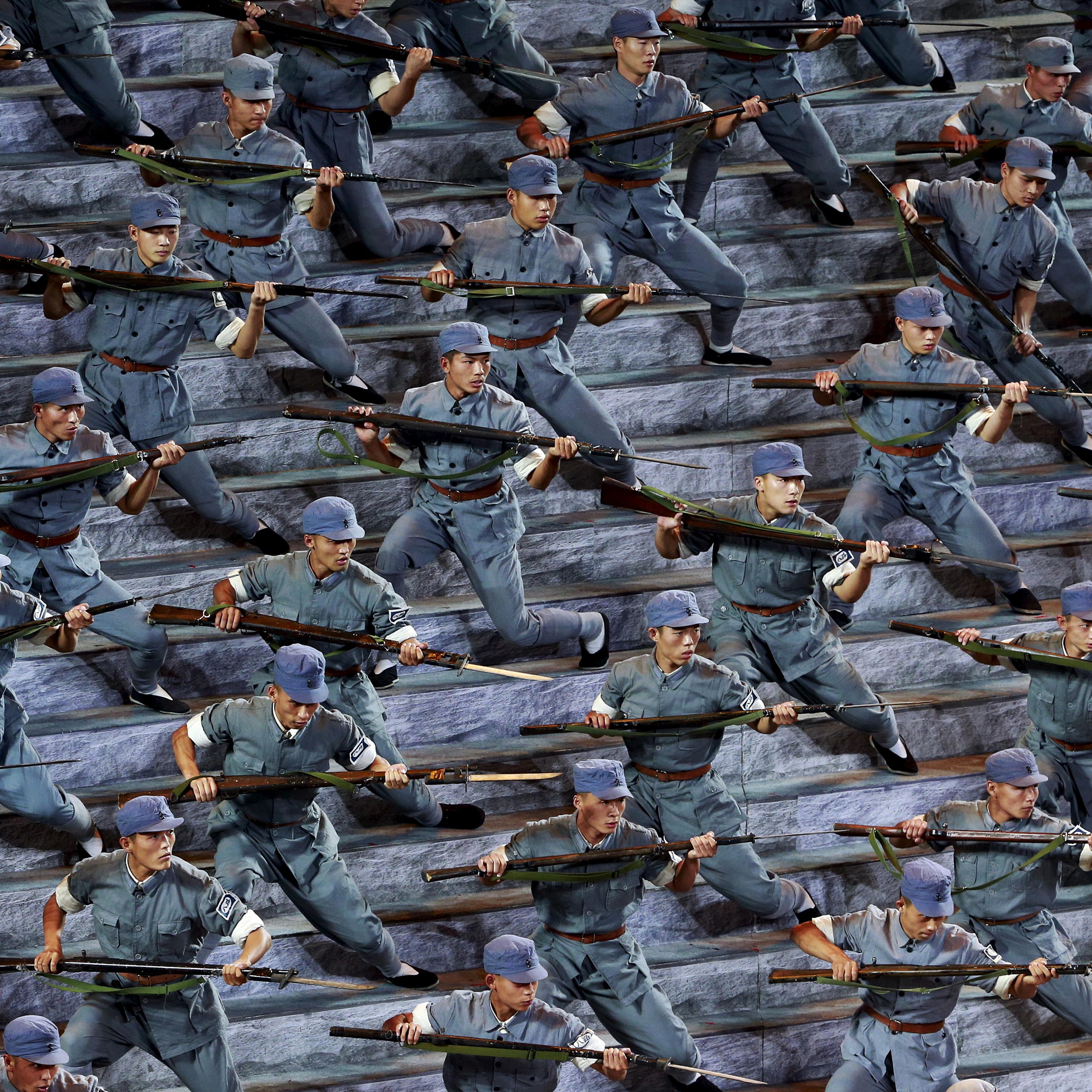 Actors dressed as Red Army soldiers perform at a gala show to mark the 70th anniversary of the end of World War Two, in Beijing
