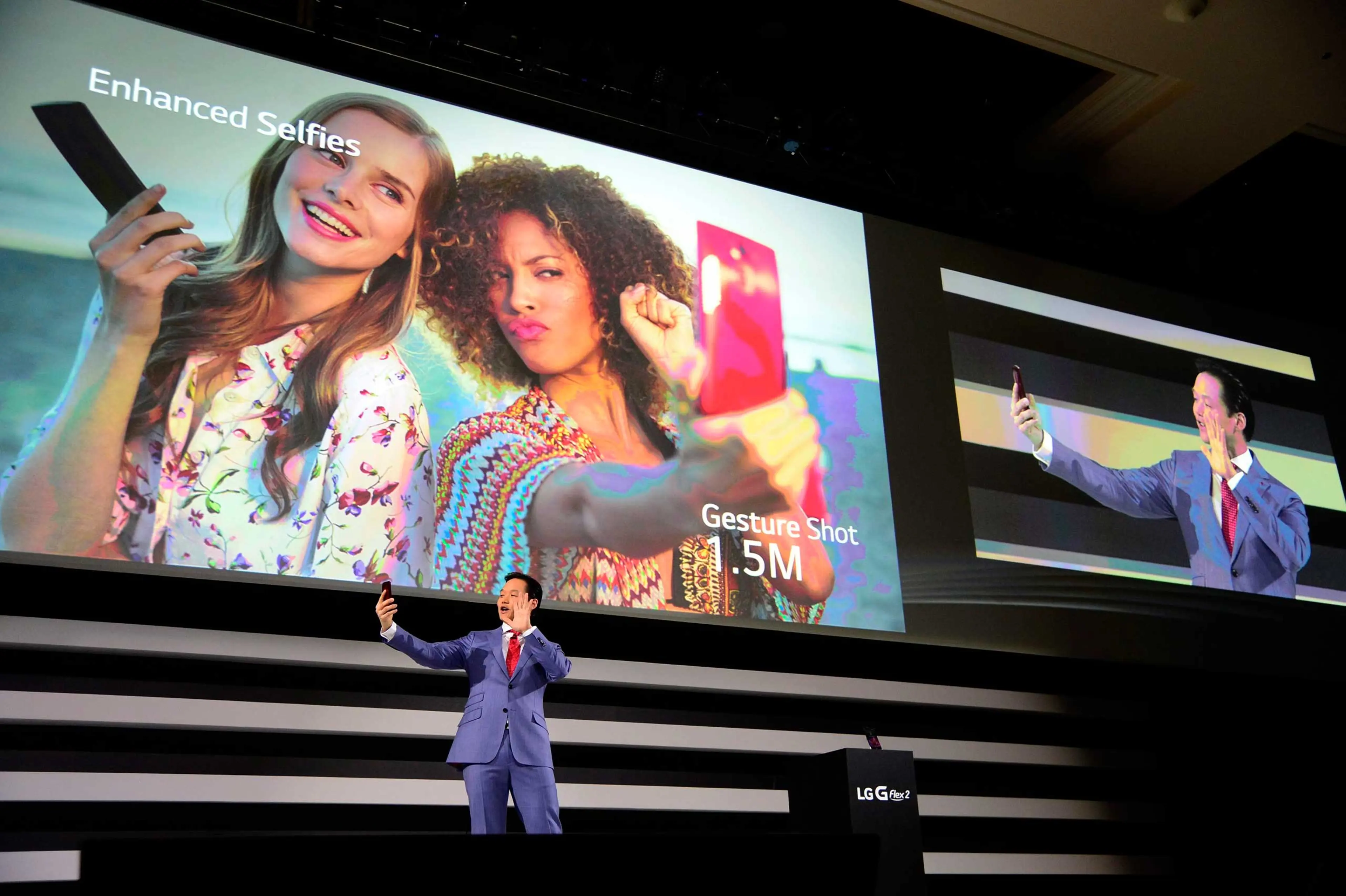 Frank Lee, Brand Marketing for LG Electronics MobileComm USA, demonstrates the enhanced selfie feature on the new LG G Flex 2 mobile phone on press day for the 2015 International Consumer Electronics Show (CES) at the Mandalay Bay Convention Center in La