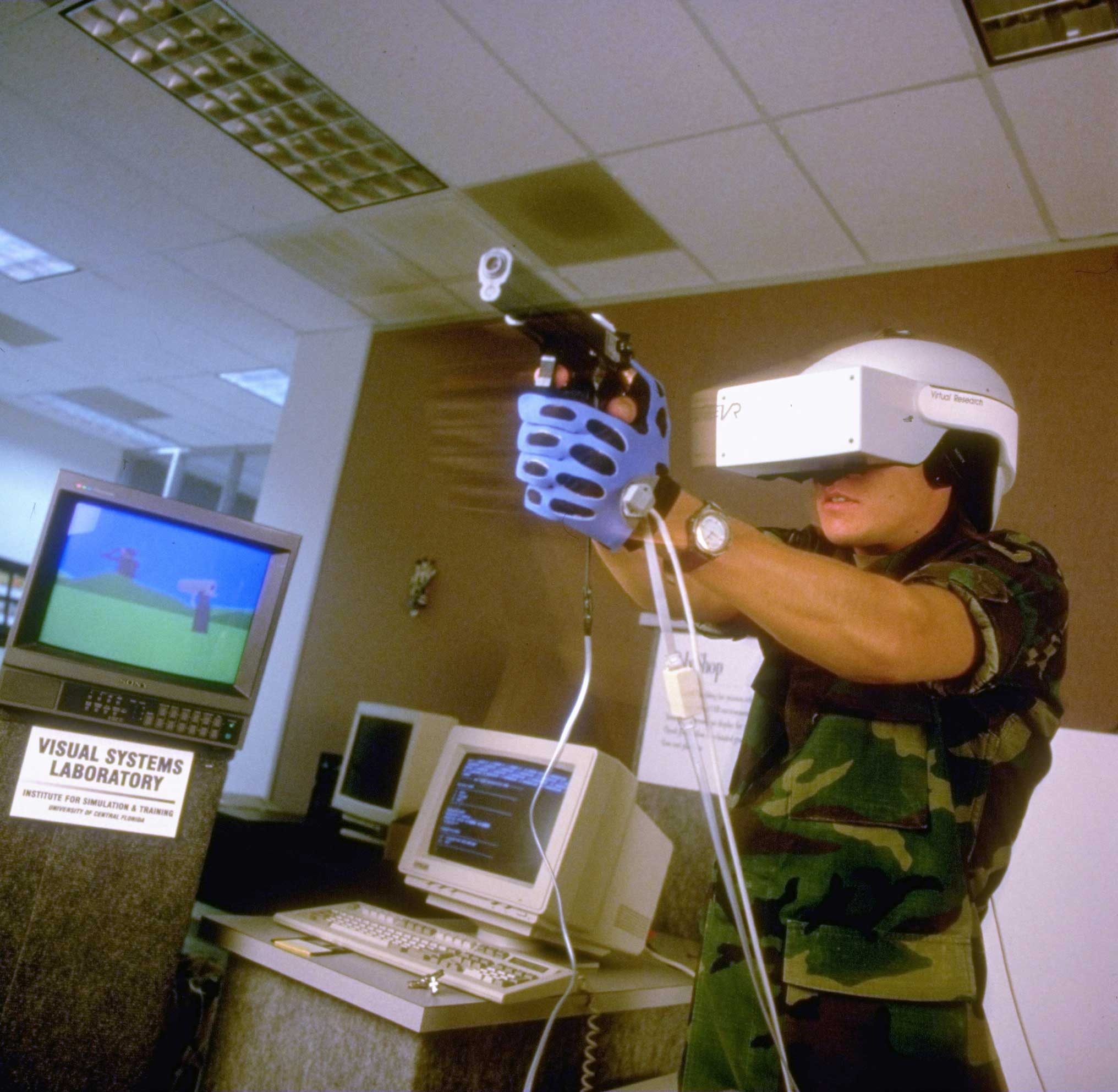 Soldier training using a virtual reality-simulated 3-D shootout at an Army facility.