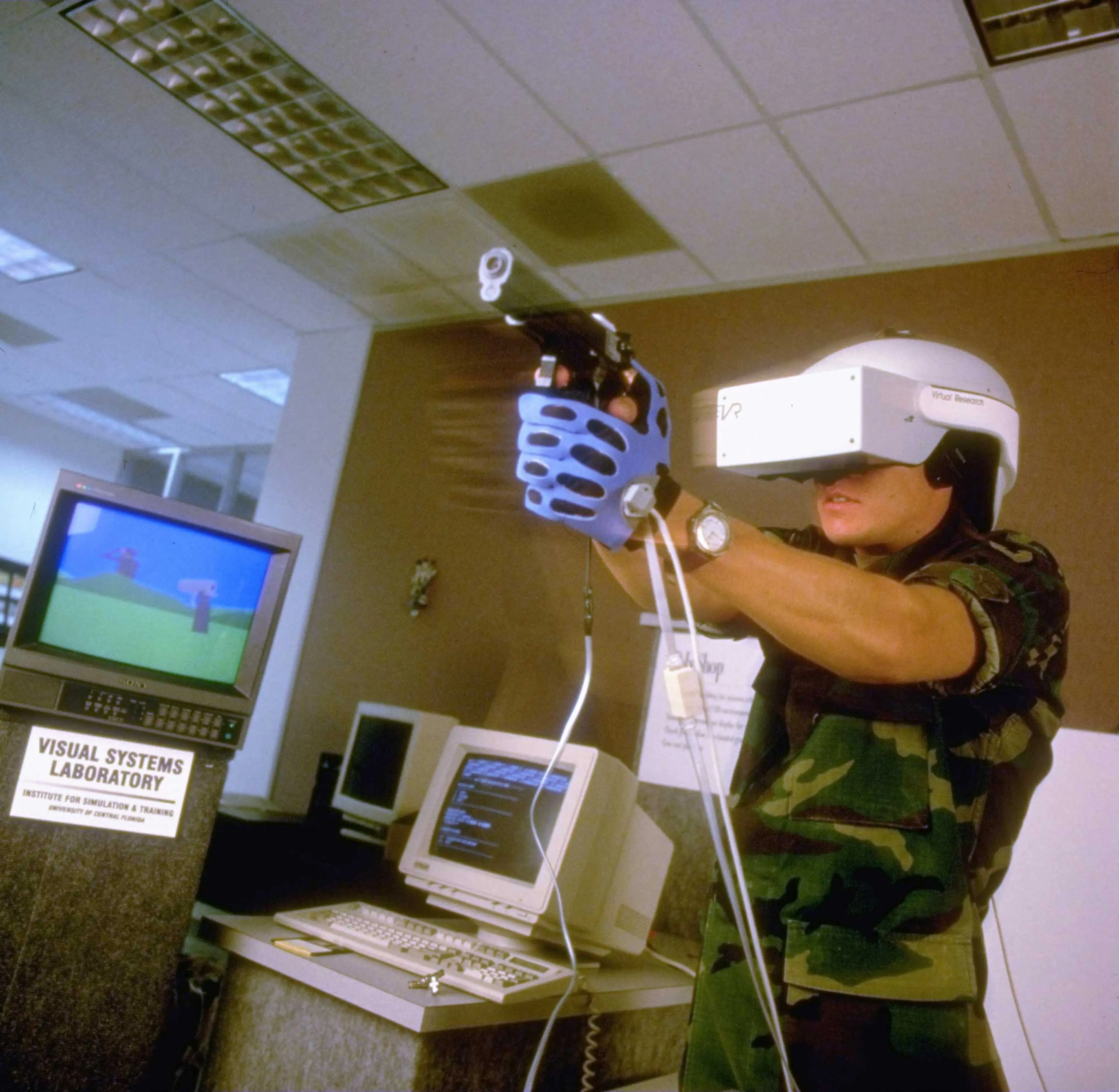 Soldier training using a virtual reality-simulated 3-D shootout at an Army facility.
