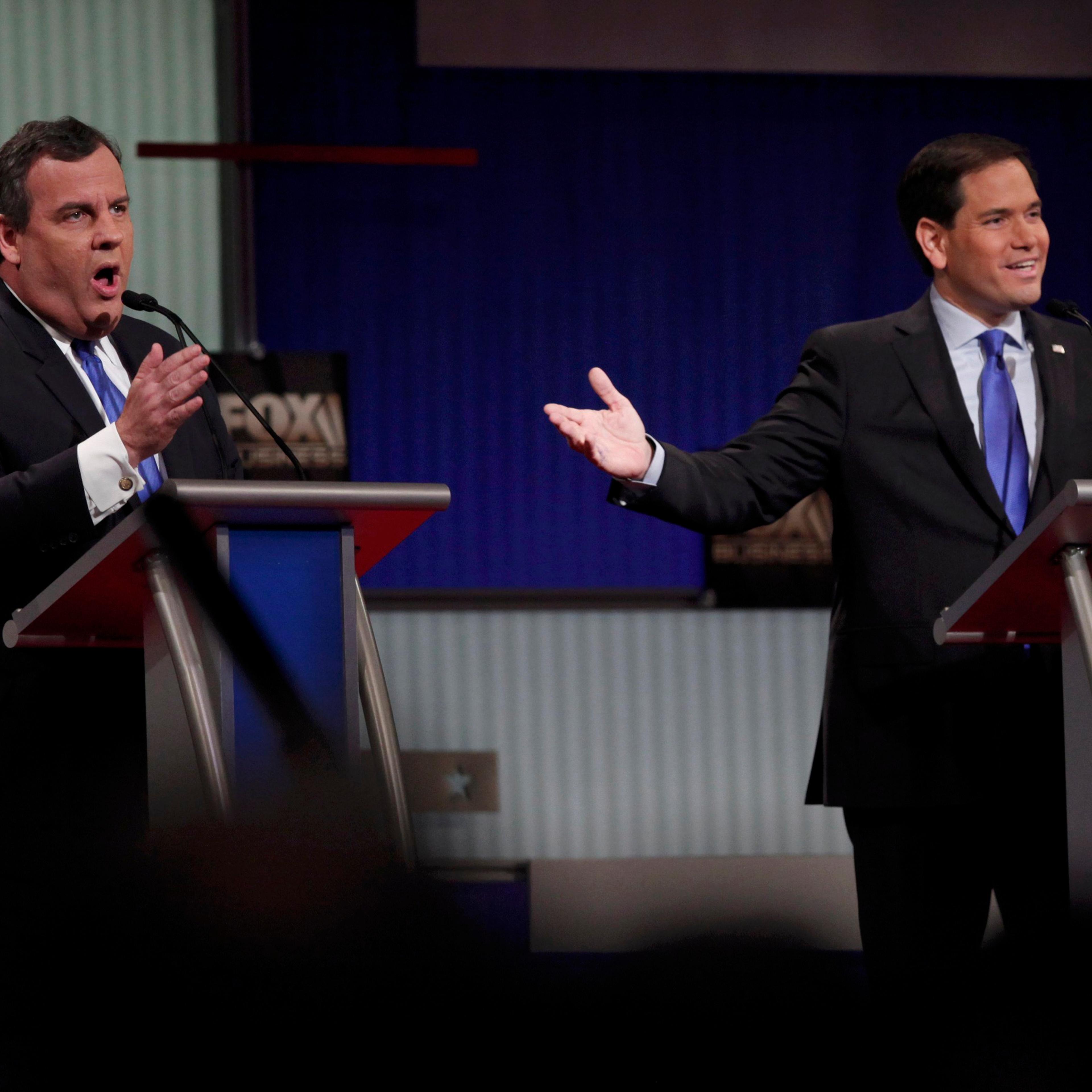 Republican U.S. presidential candidate Christie and Rubio speak simultaneously during the Fox Business Network Republican presidential candidates debate in North Charleston