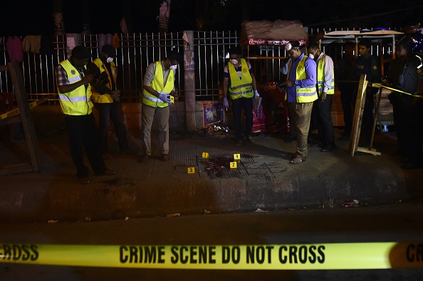 Police forensics investigate the scene where U.S. blogger of Bangladeshi origin was hacked to death by unidentified assailants in Dhaka on February 27, 2015.