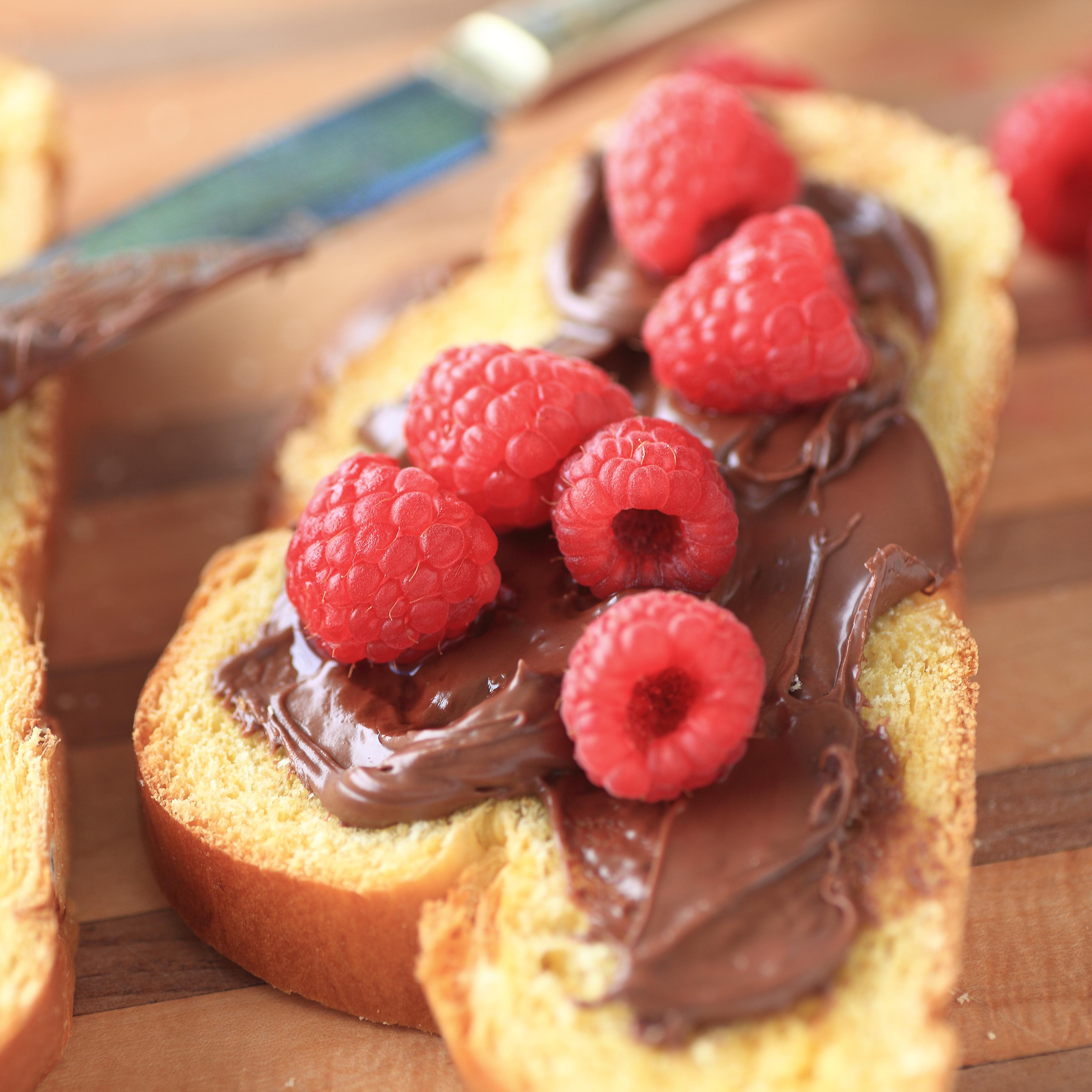 Raspberries With Nutella On Bread Slices