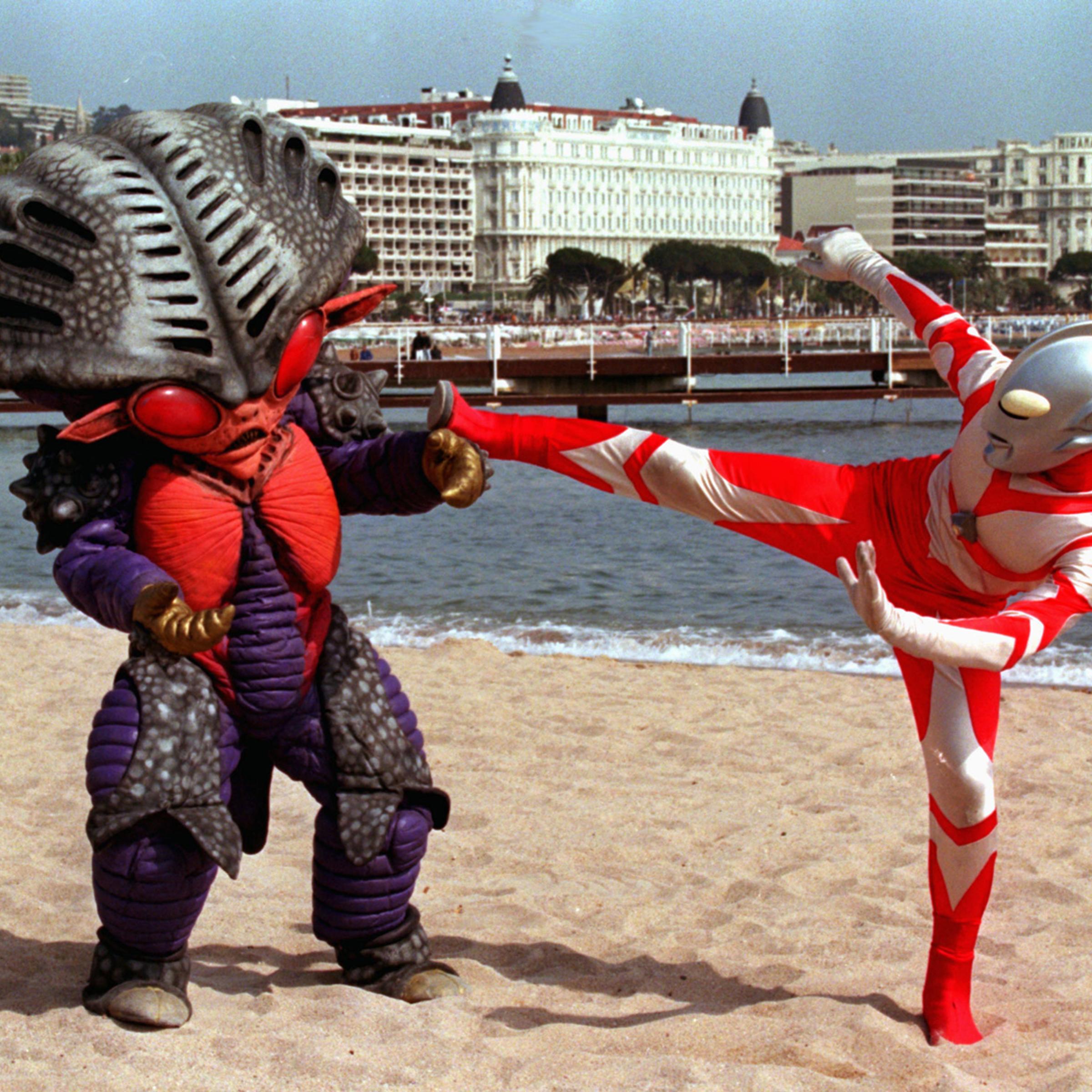 Japanese characters Ultraman, right, and Alien Benzene stage a fight on the French Riviera