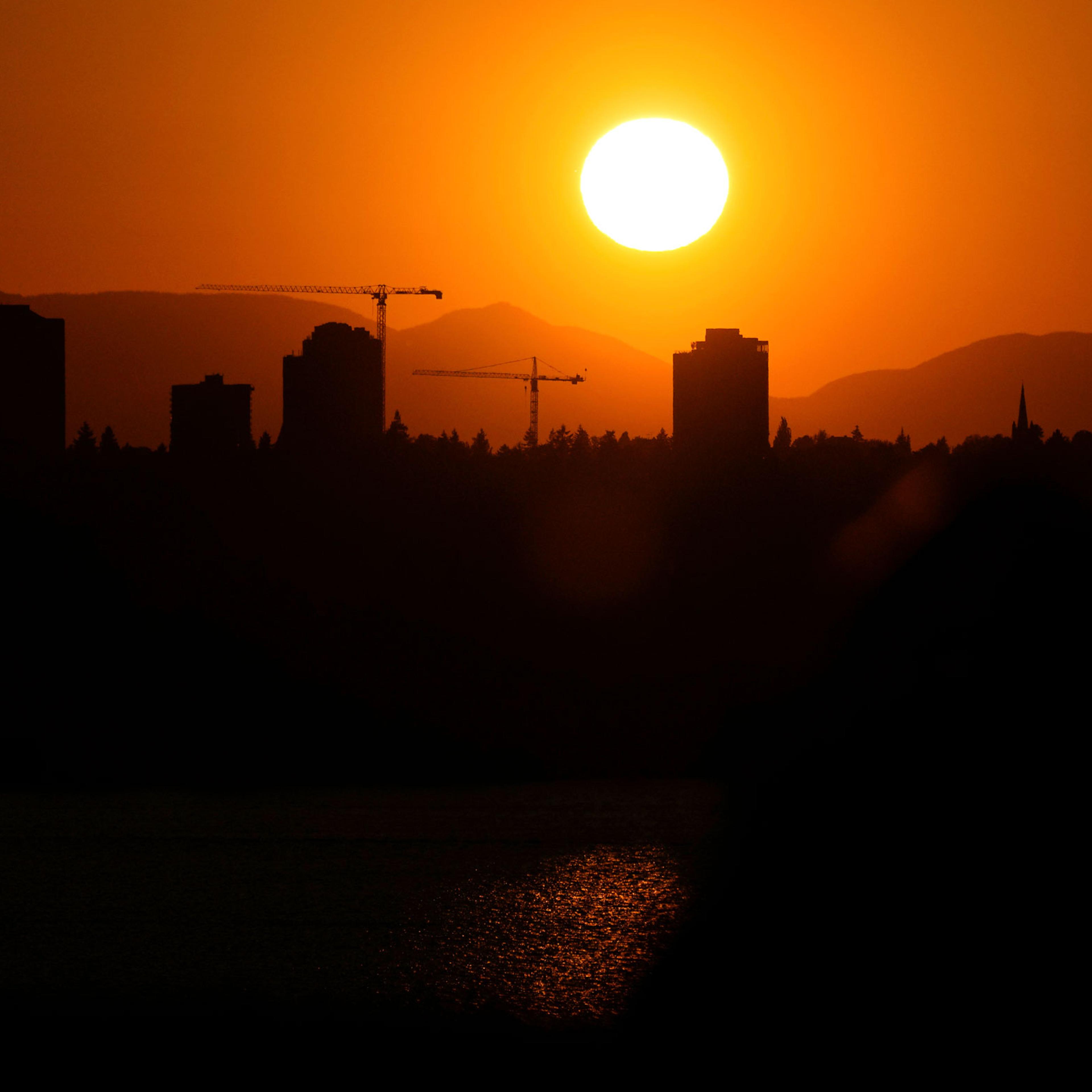The sun sets over the University District in Seattle, on May 13, 2023