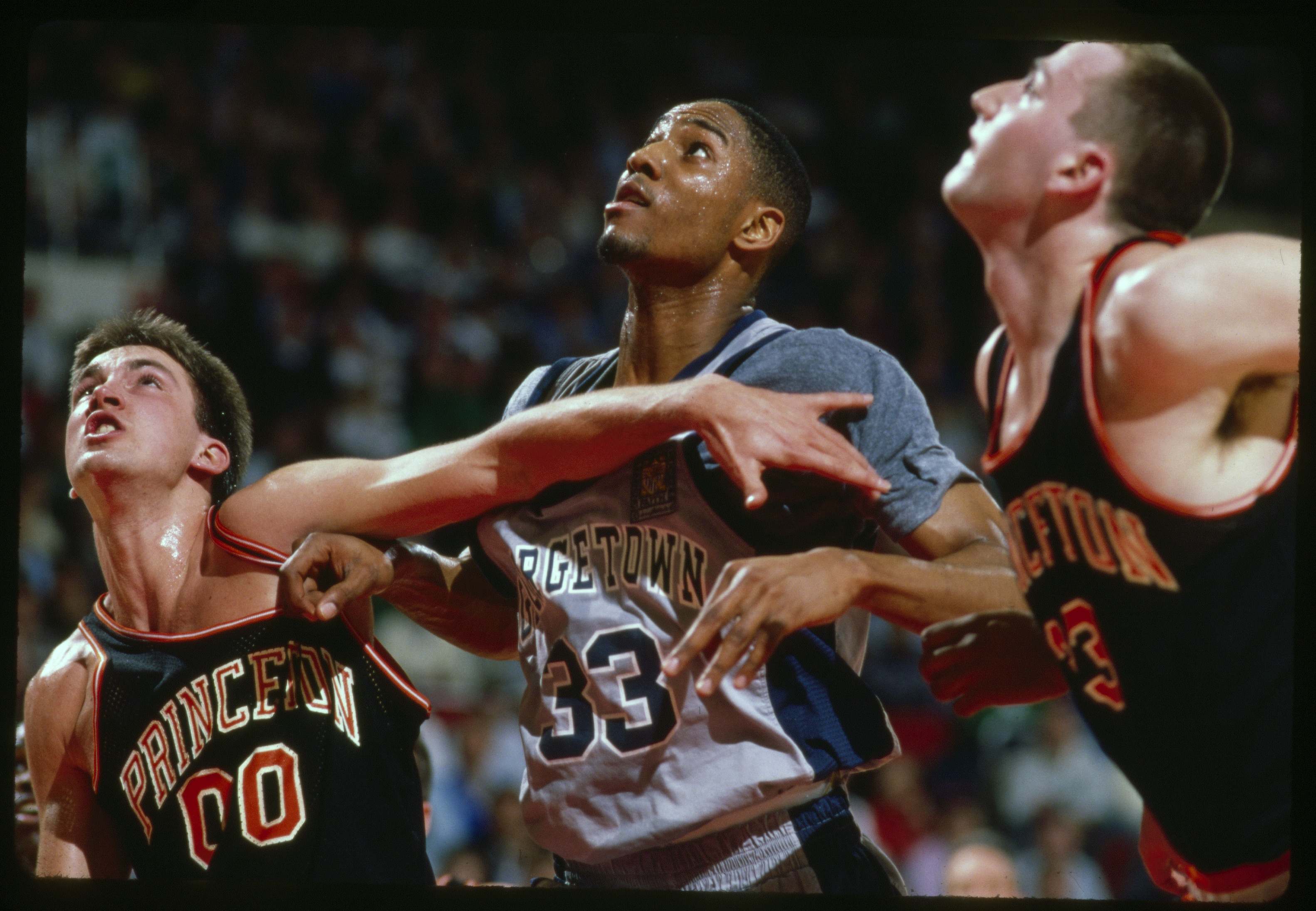 Georgetown's Alonzo Mourning (center) versus Princeton's Matt Lapin (33) and Kit Mueller (00) at Providence Civic Center, in Providence, R.I., on March 17, 1989.