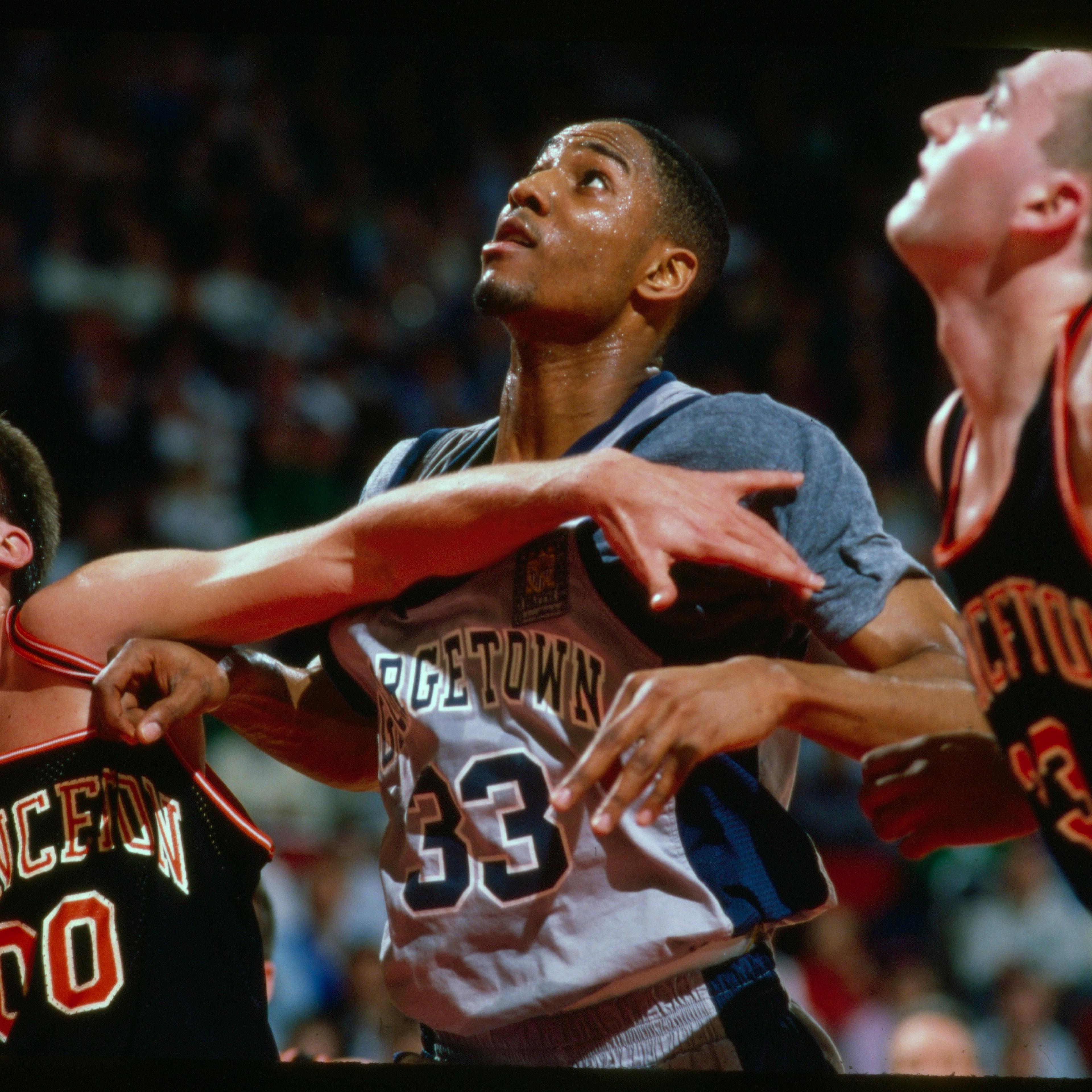Georgetown's Alonzo Mourning (center) versus Princeton's Matt Lapin (33) and Kit Mueller (00) at Providence Civic Center, in Providence, R.I., on March 17, 1989.