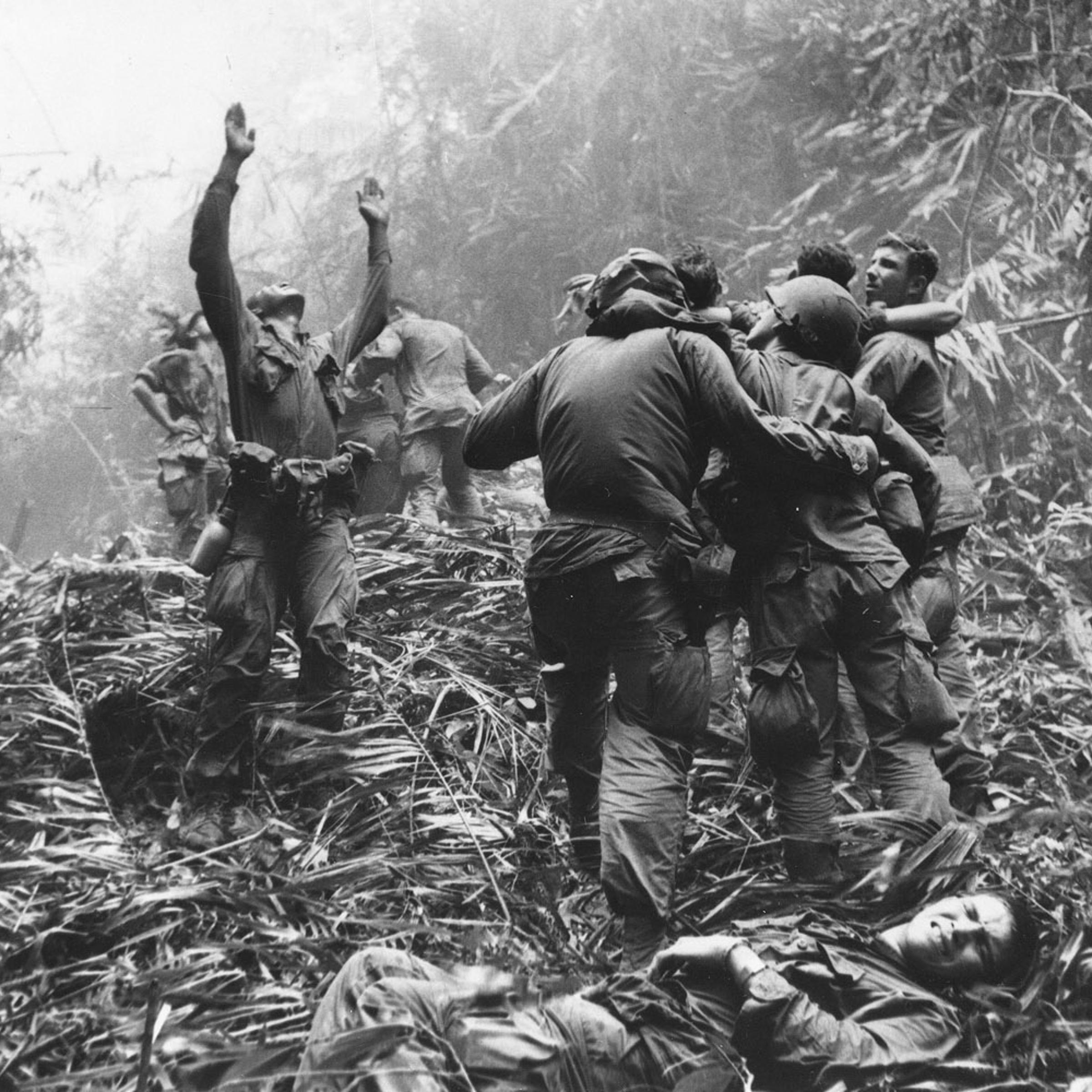 As fellow troopers aid wounded buddies, a paratrooper of A Company, 101st Airborne, guides a medical evacuation helicopter through the jungle foliage to pick up casualties during a five-day patrol of an area southwest of Hue, South Vietnam, April 1968. <br><br><i>This photograph is featured on the cover of the Associated Press' new book 'Vietnam: The Real War' (Abrams, Oct. 2013).</i>