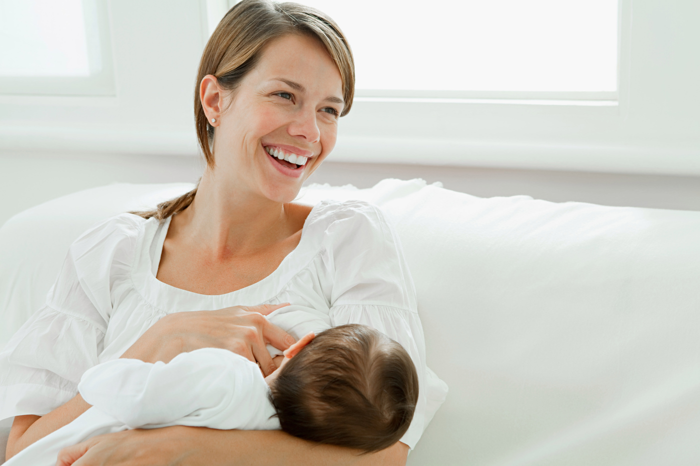 Mother breast feeding baby