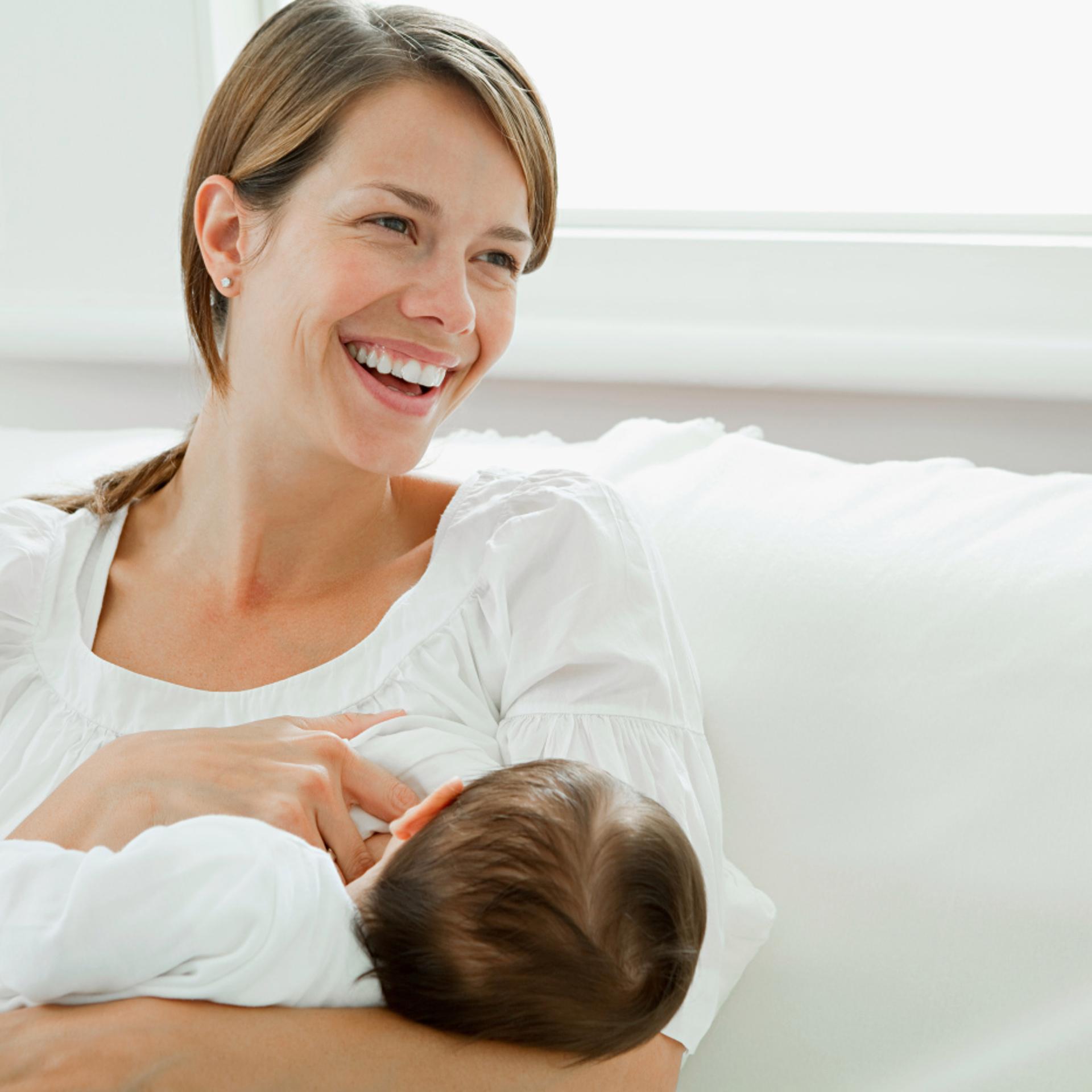 Mother breast feeding baby