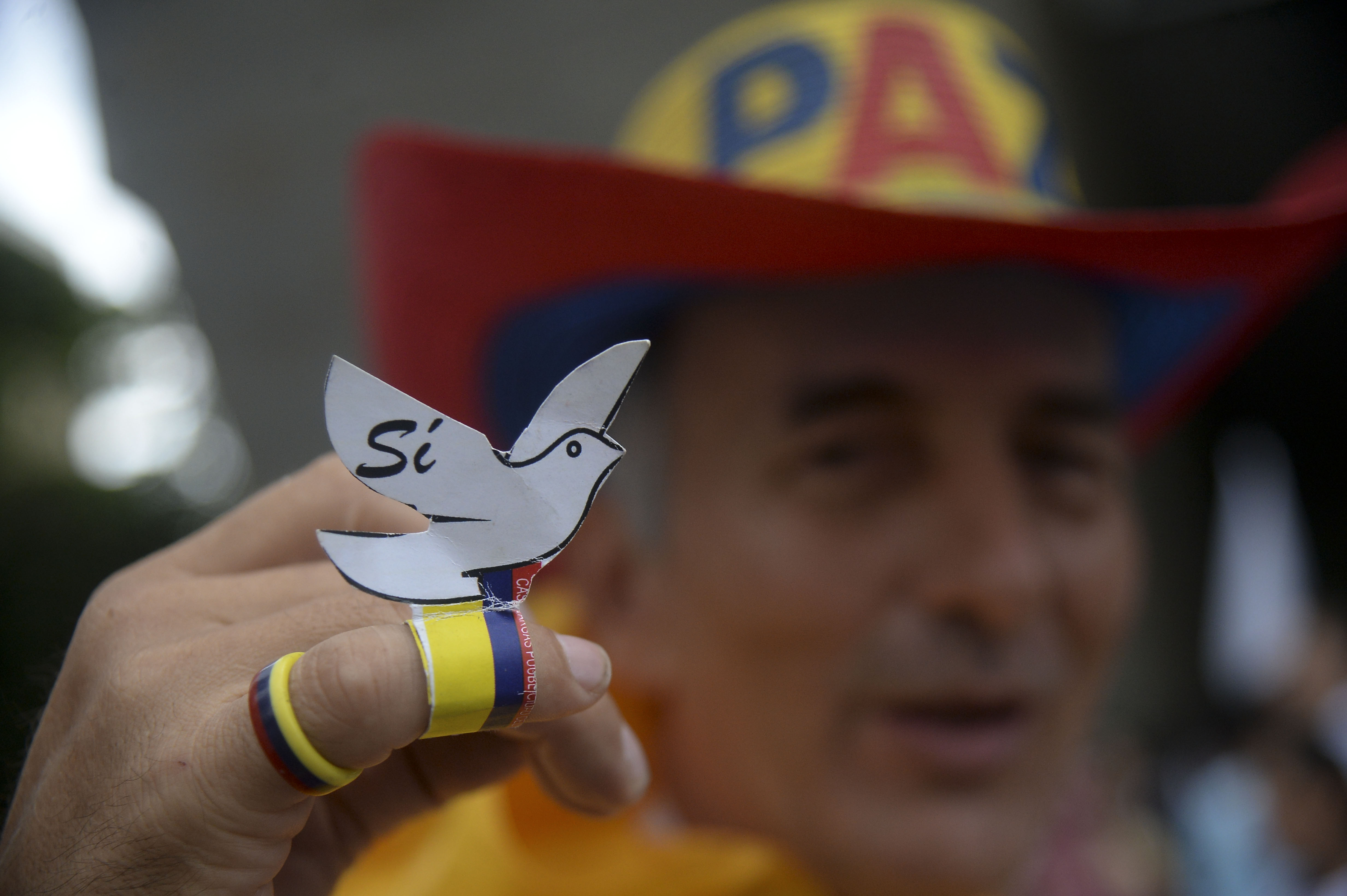 Picture taken during a march for peace through the streets of Medellin, Colombia, on October 7, 2016 just days after voters shot down a historic peace accord between the government and the Revolutionary Armed Forces of Colombia (FARC) to end the war.