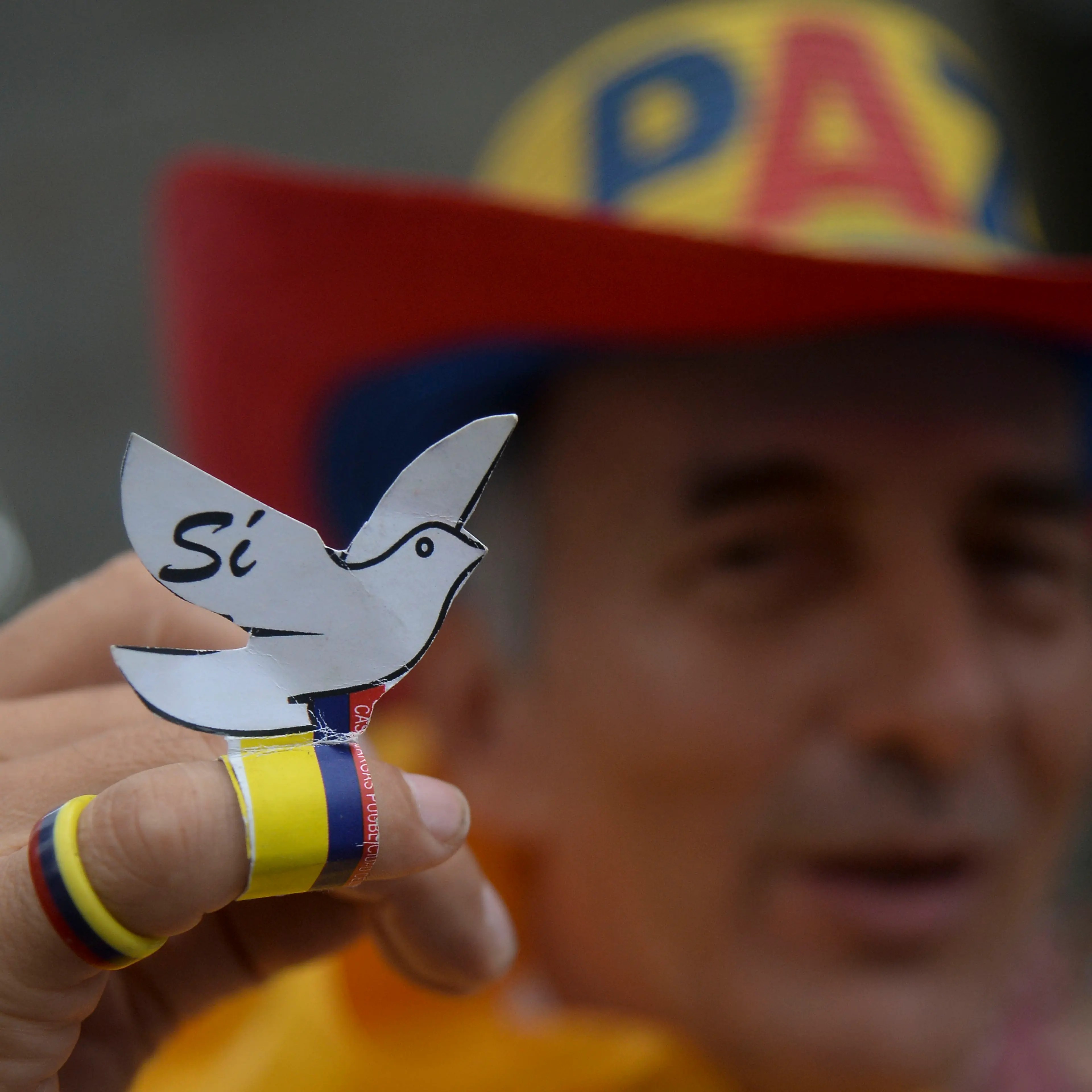 Picture taken during a march for peace through the streets of Medellin, Colombia, on October 7, 2016 just days after voters shot down a historic peace accord between the government and the Revolutionary Armed Forces of Colombia (FARC) to end the war.
