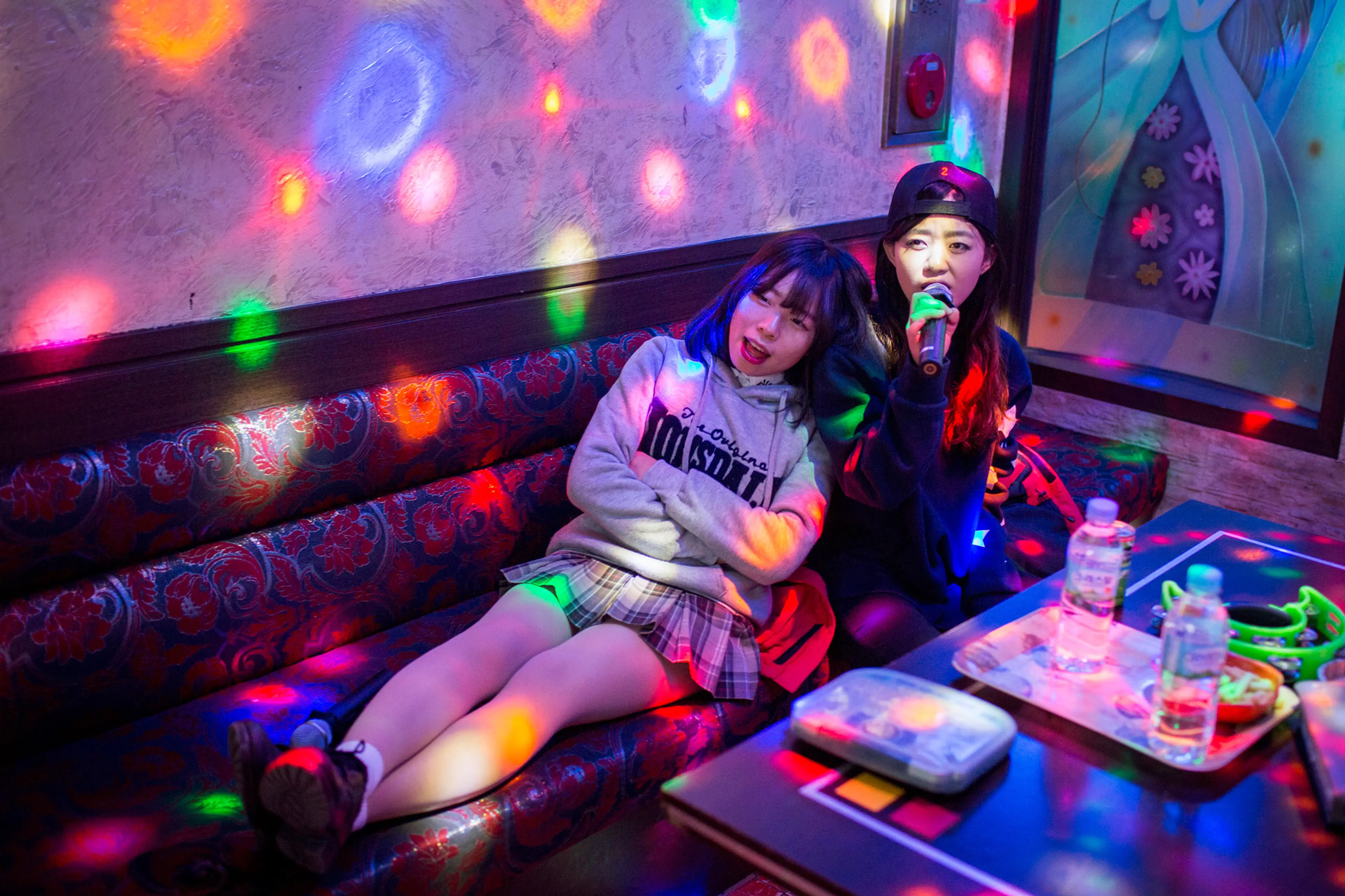 Kyoung-ok and Sarah spend time at a norebang (singing room) on Feb. 4, 2015 near Yangjae, Seoul, South Korea. When Kyong-ok first arrived in the South, it was difficult to make friends. Her fifth-grade classmates were suspicious of her, asking her whethe