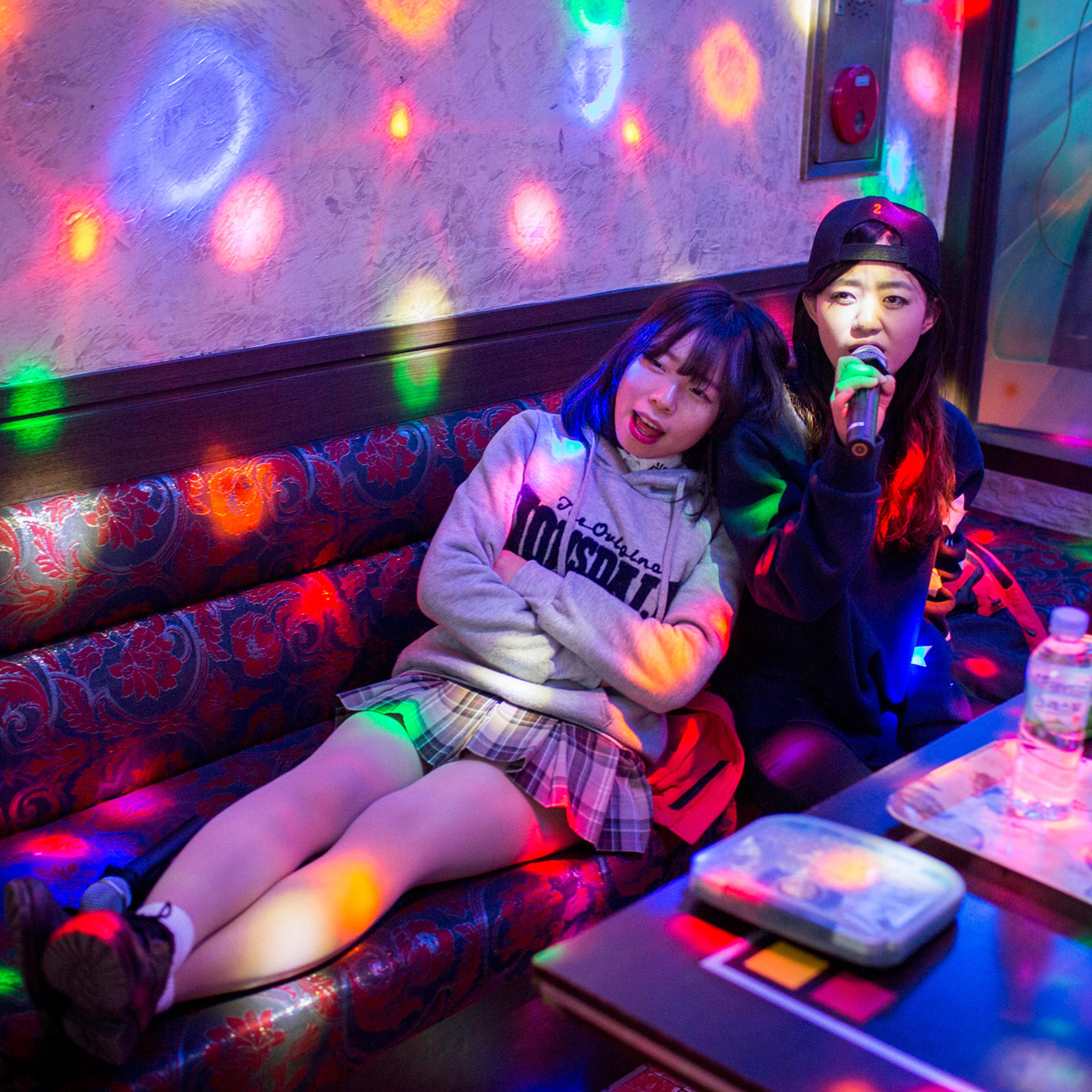 Kyoung-ok and Sarah spend time at a norebang (singing room) on Feb. 4, 2015 near Yangjae, Seoul, South Korea. When Kyong-ok first arrived in the South, it was difficult to make friends. Her fifth-grade classmates were suspicious of her, asking her whethe