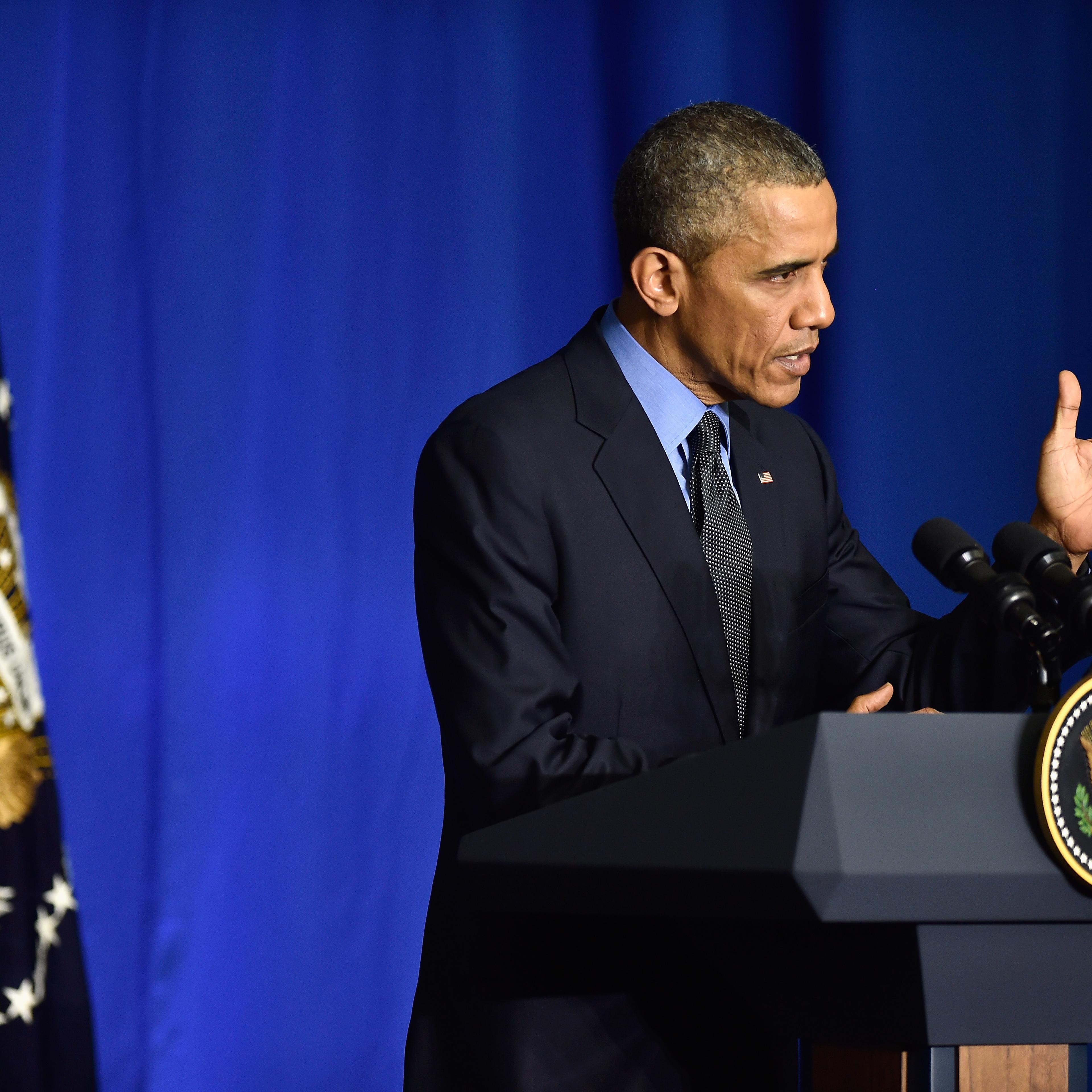 President Barack Obama speaks during a press conference at the OECD Conference Centre before leaving the Conference On Climate Change COP21 on Dec. 1, 2015 in Paris.