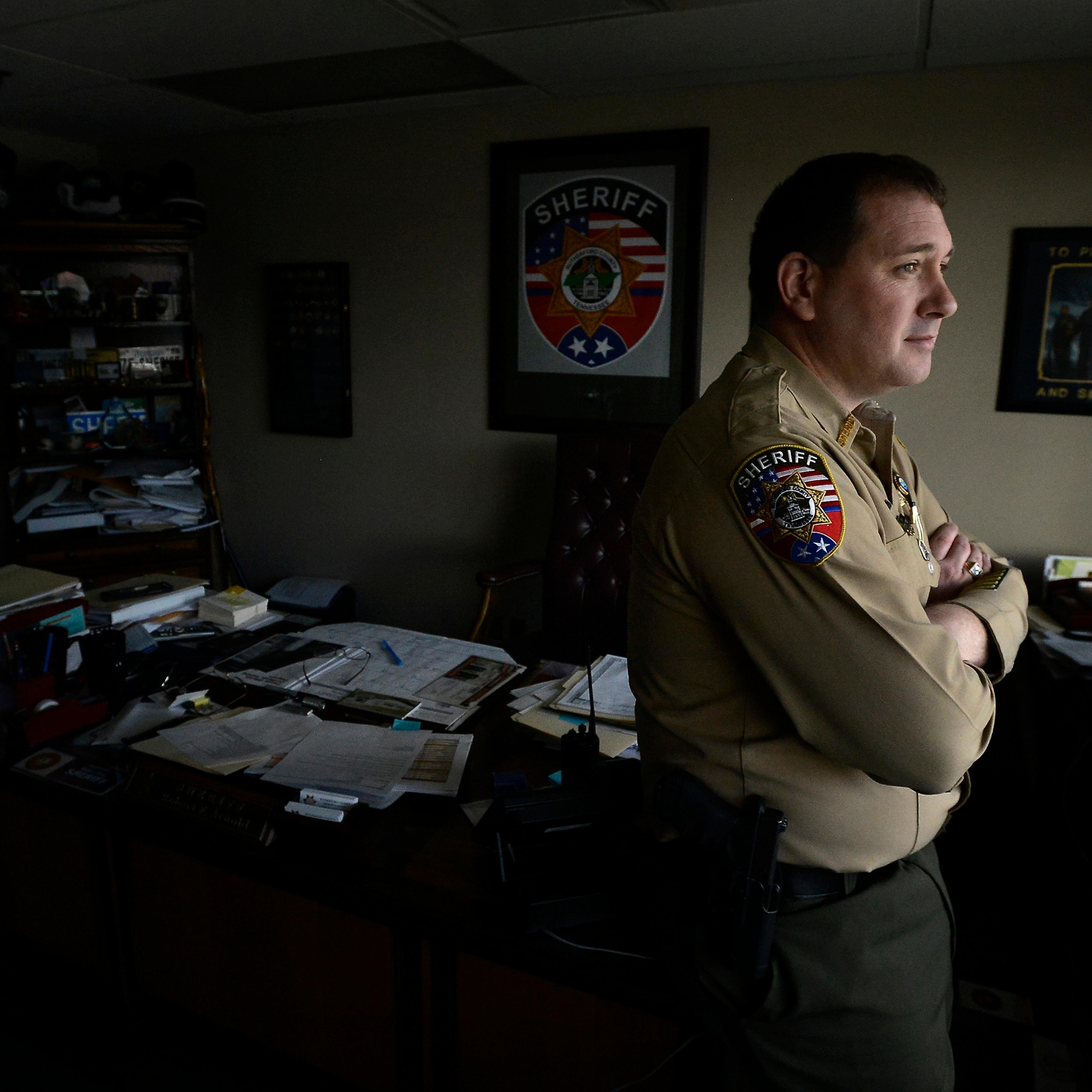 FILE - In this Jan. 27, 2016 file photo, Rutherford County Sheriff Robert F. Arnold stands in his office in Murfreesboro, Tenn. Arnold is facing public corruption charges after being named in a 14-count indictment that accuses him and others of benefitin