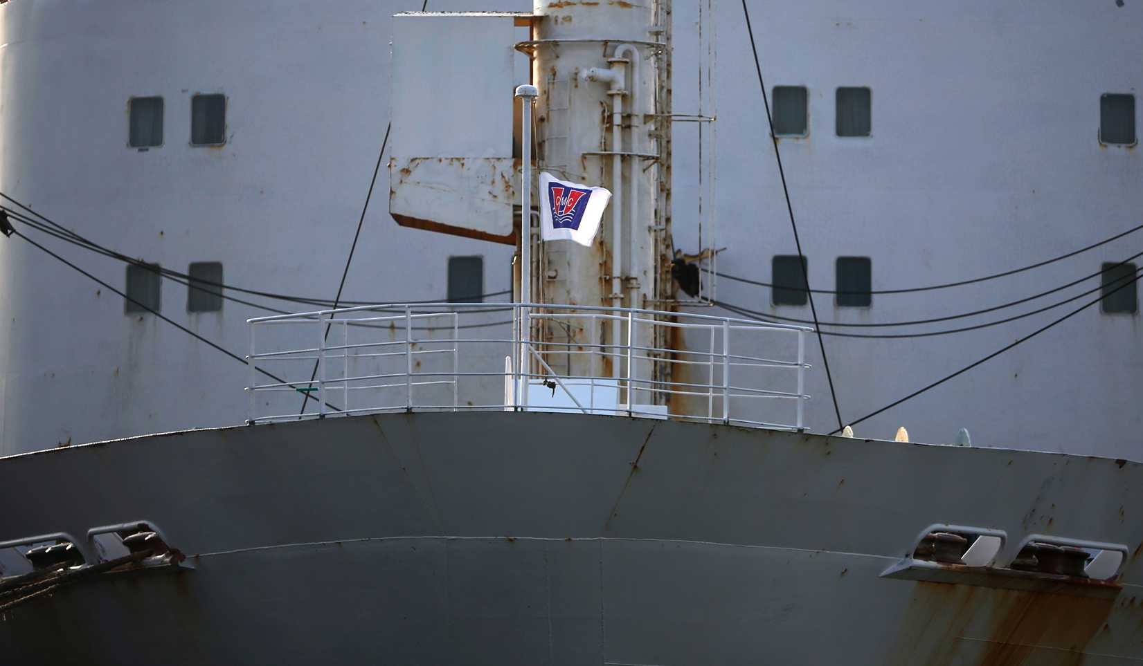 A flag depicting the company logo of Chonghaejin Marine Co flutters on its ferry Ohamana at Incheon Port Passenger Terminal in Incheon April 22, 2014.