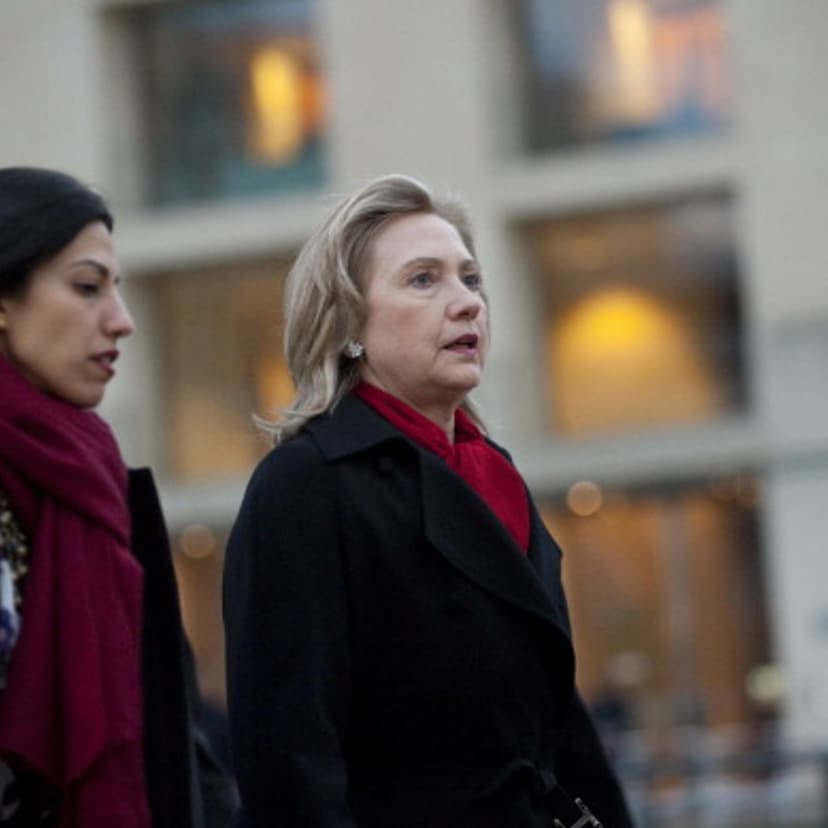 US Secretary of State Hillary Clinton (R) and Deputy Chief of Staff Huma Abedin arrive for a NATO Foreign Minister family photo in front of the Brandenburg Gate in Berlin April 14, 2011.