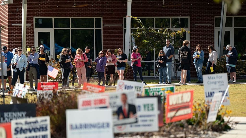 People wait in line to participate in early voting for the midterm elections in Cary, North Carolina, on October 25, 2026.Allison Joyce—AFP/Getty Images