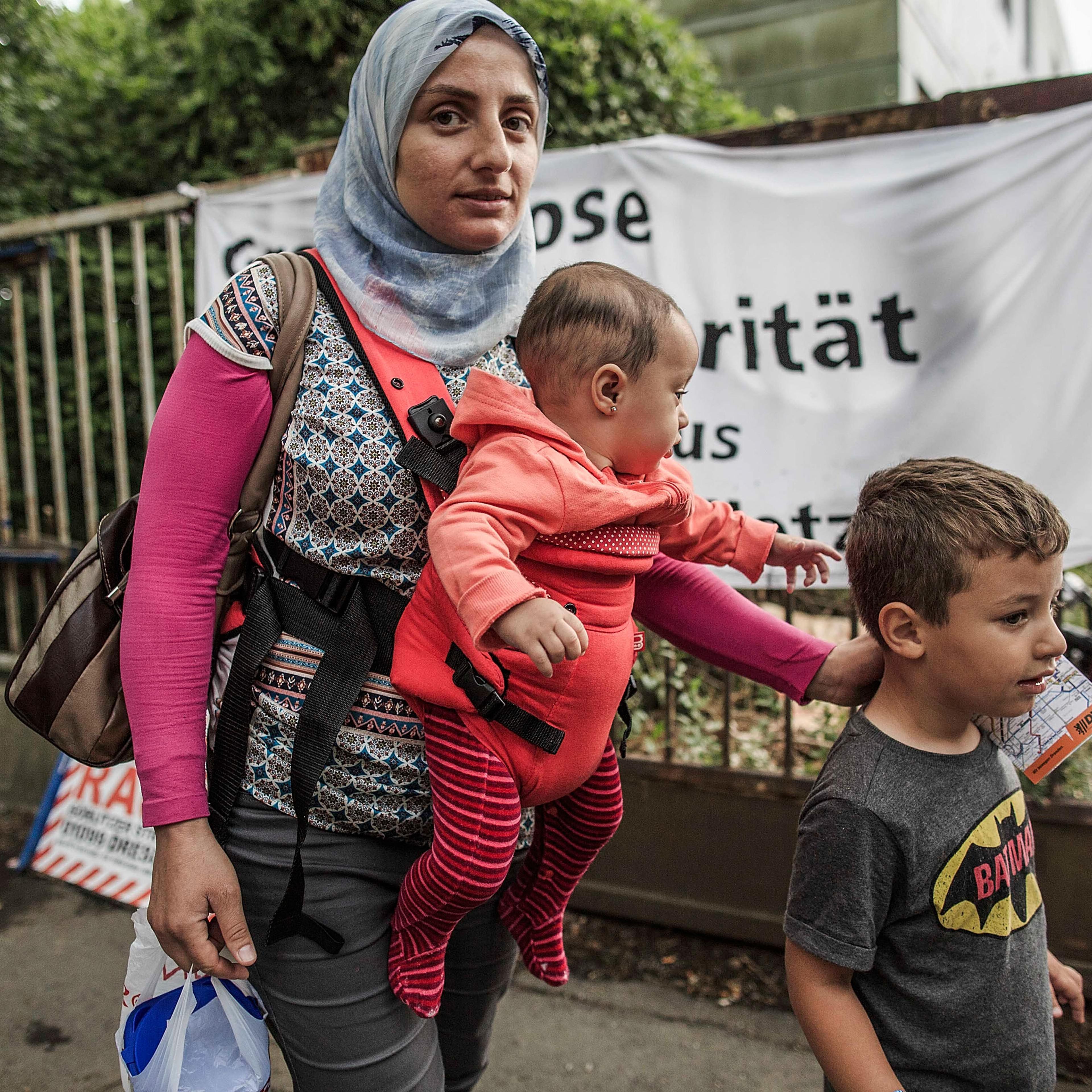 Refugees Arrive In Dresden Amidst Protests