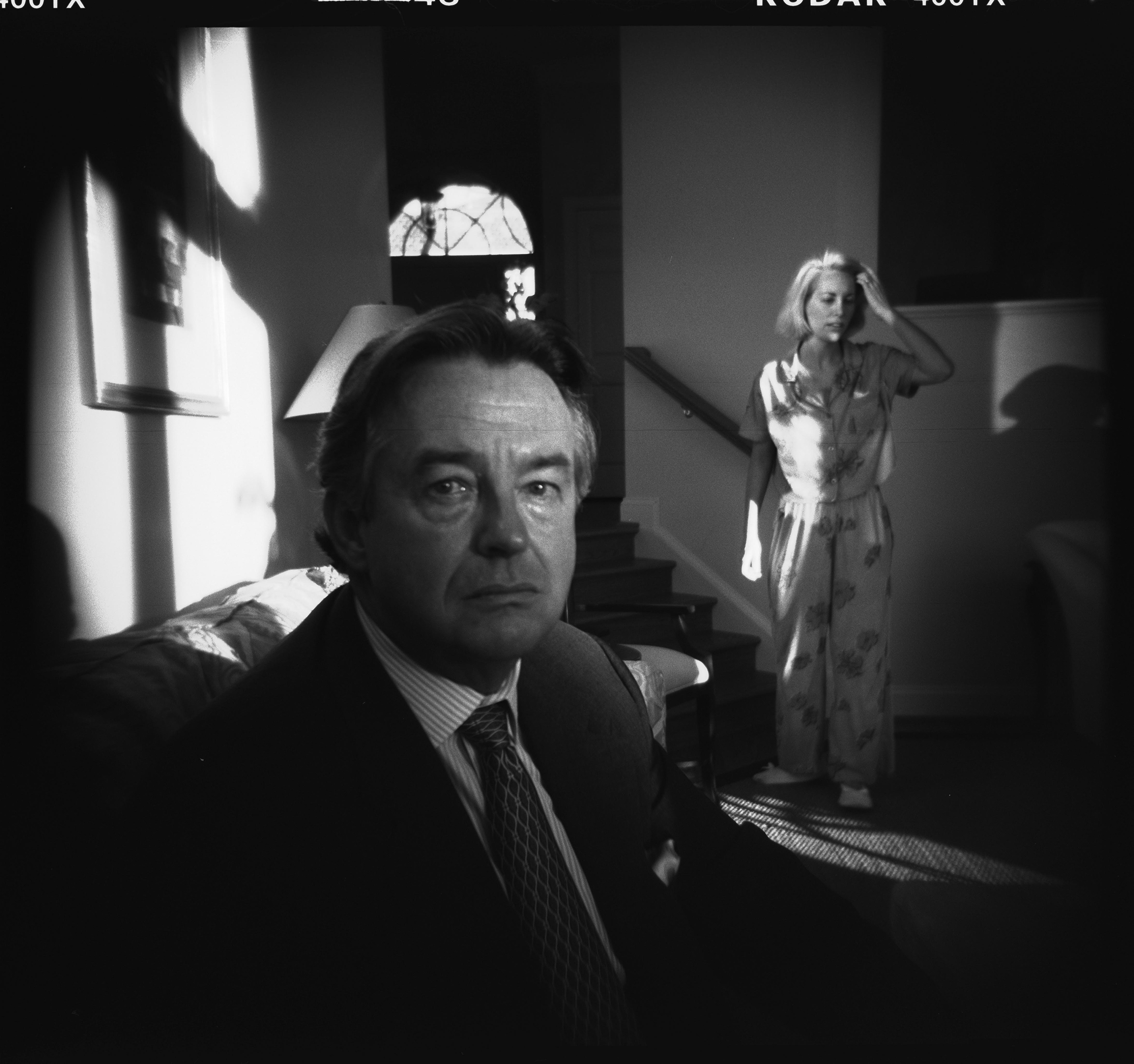 Ambassador Joseph Wilson, with his wife Valerie Plame in the background, at home in Washington, D.C., in October 2003.