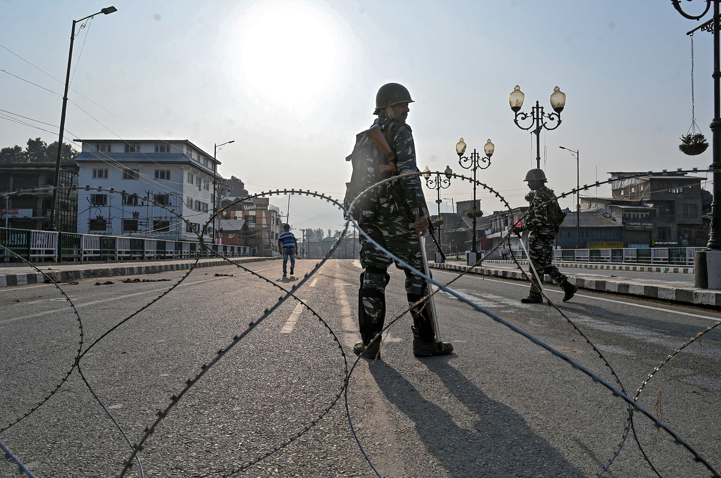 Indian troops stand guard on Aug. 5 during a curfew in the Kashmir Valley city of Srinagar.