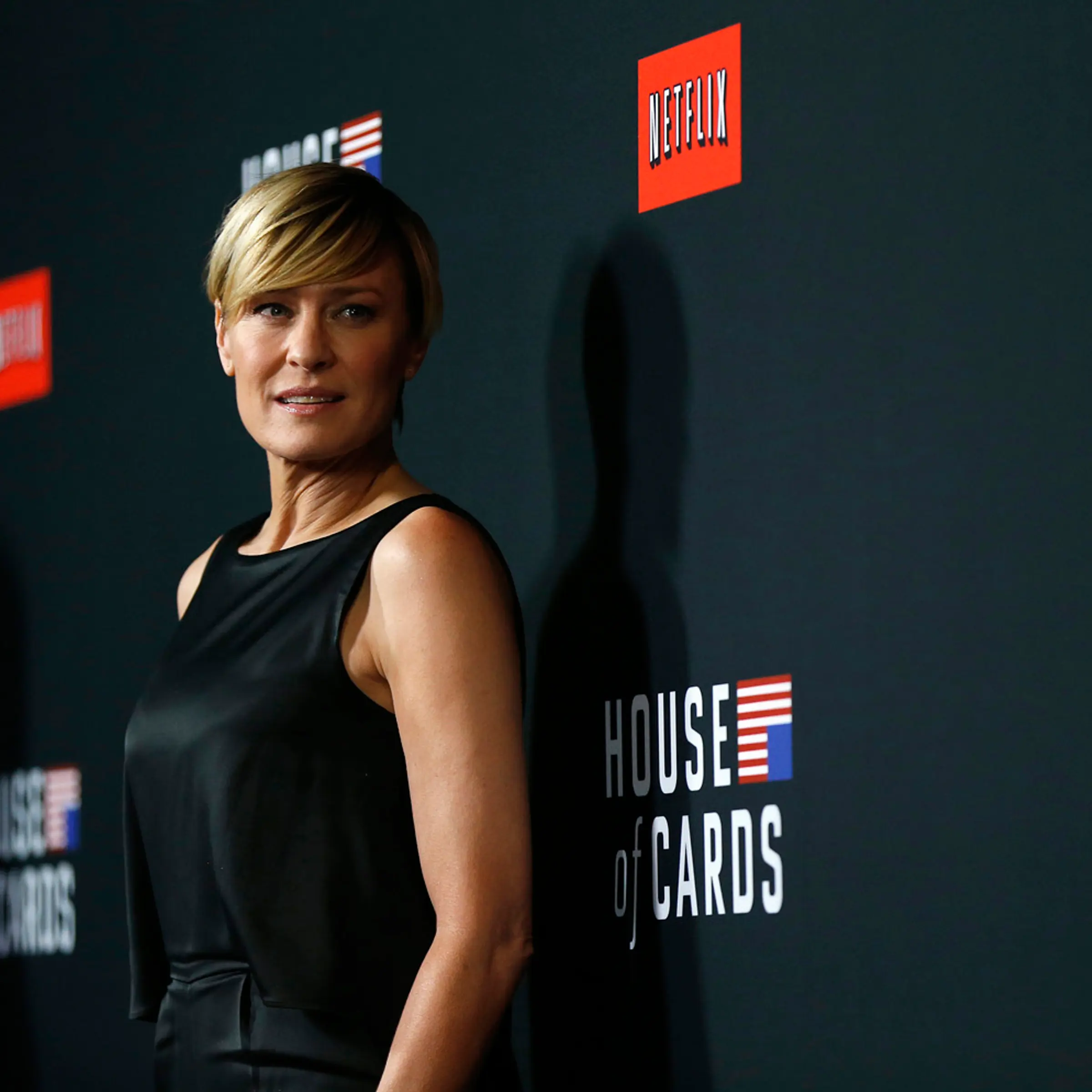 Cast member Robin Wright poses at the premiere for the second season of the television series "House of Cards" at the Directors Guild of America in Los Angeles, California February 13, 2014. Season 2 premieres on Netflix on February 14.