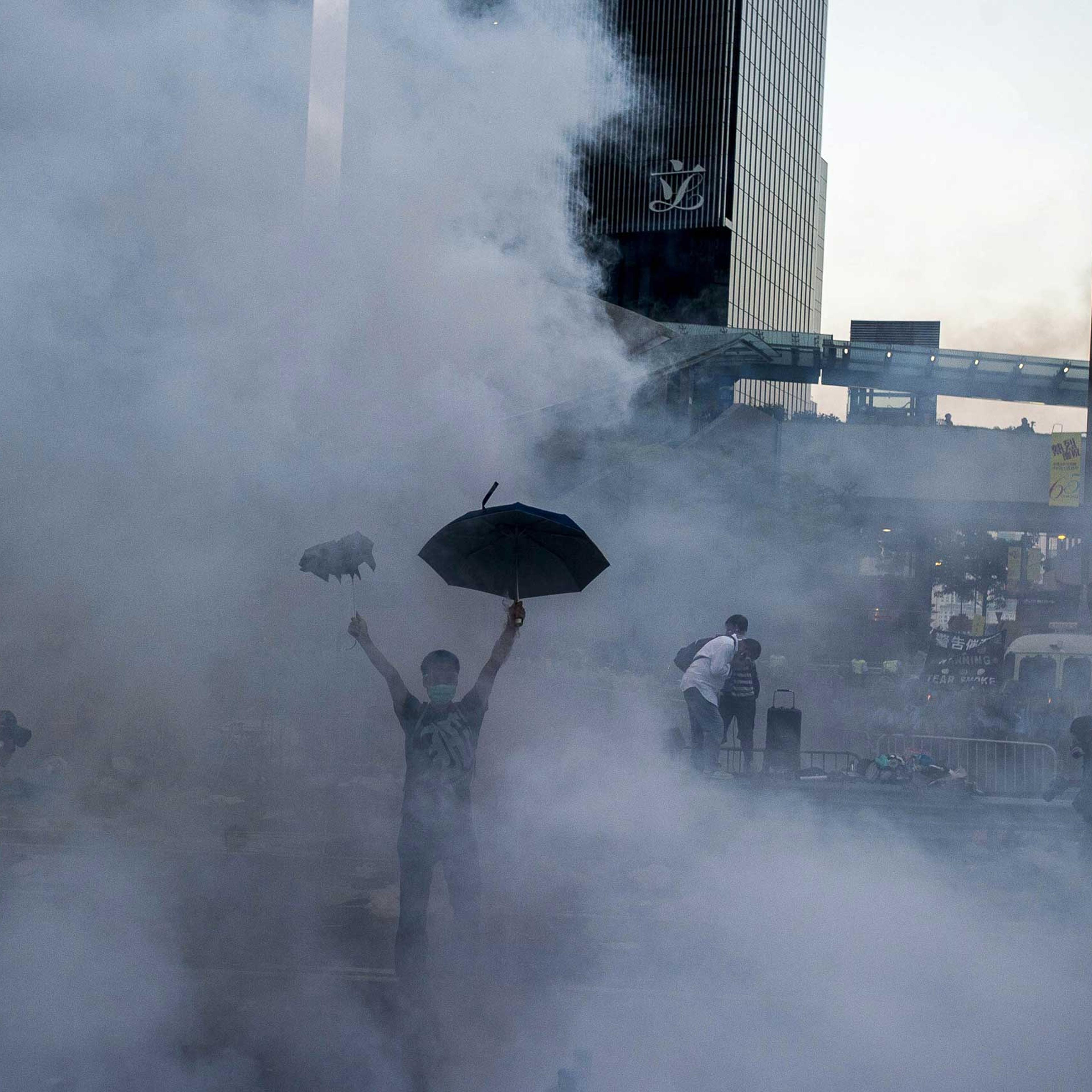 A pro-democracy demonstrator gestures after police fired tear gas towards protesters near the Hong Kong government headquarters on Sept. 28, 2014.