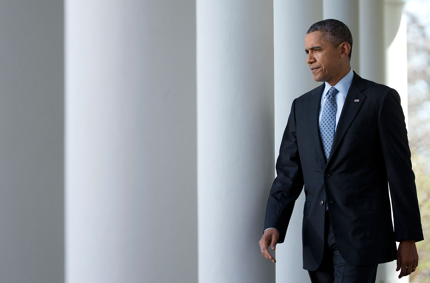 President Barack Obama walks from the Oval Office to the Rose Garden of the White House in Washington, Tuesday, April 1, 2014.