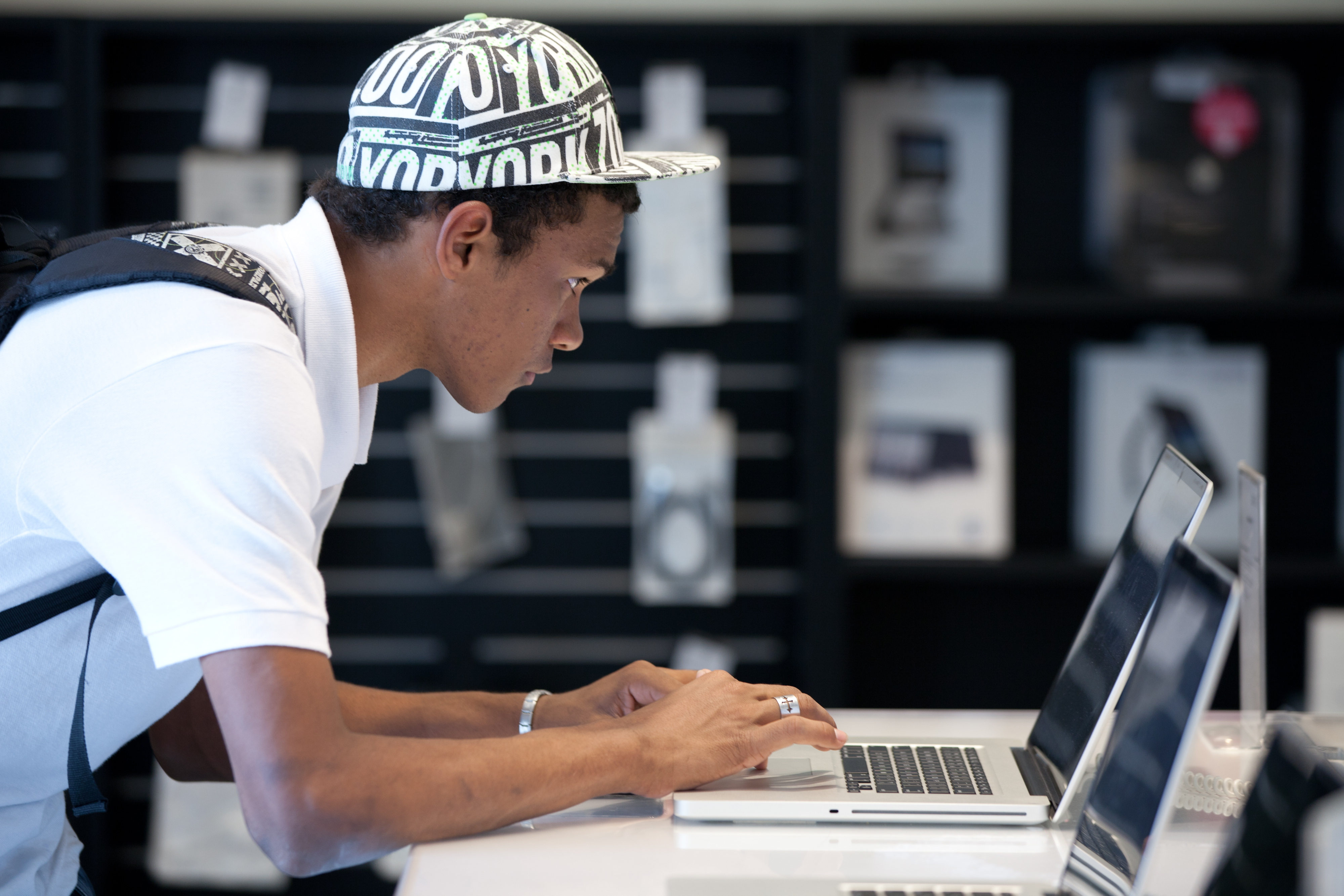 A Brazilian man looks at Apple's Macbook