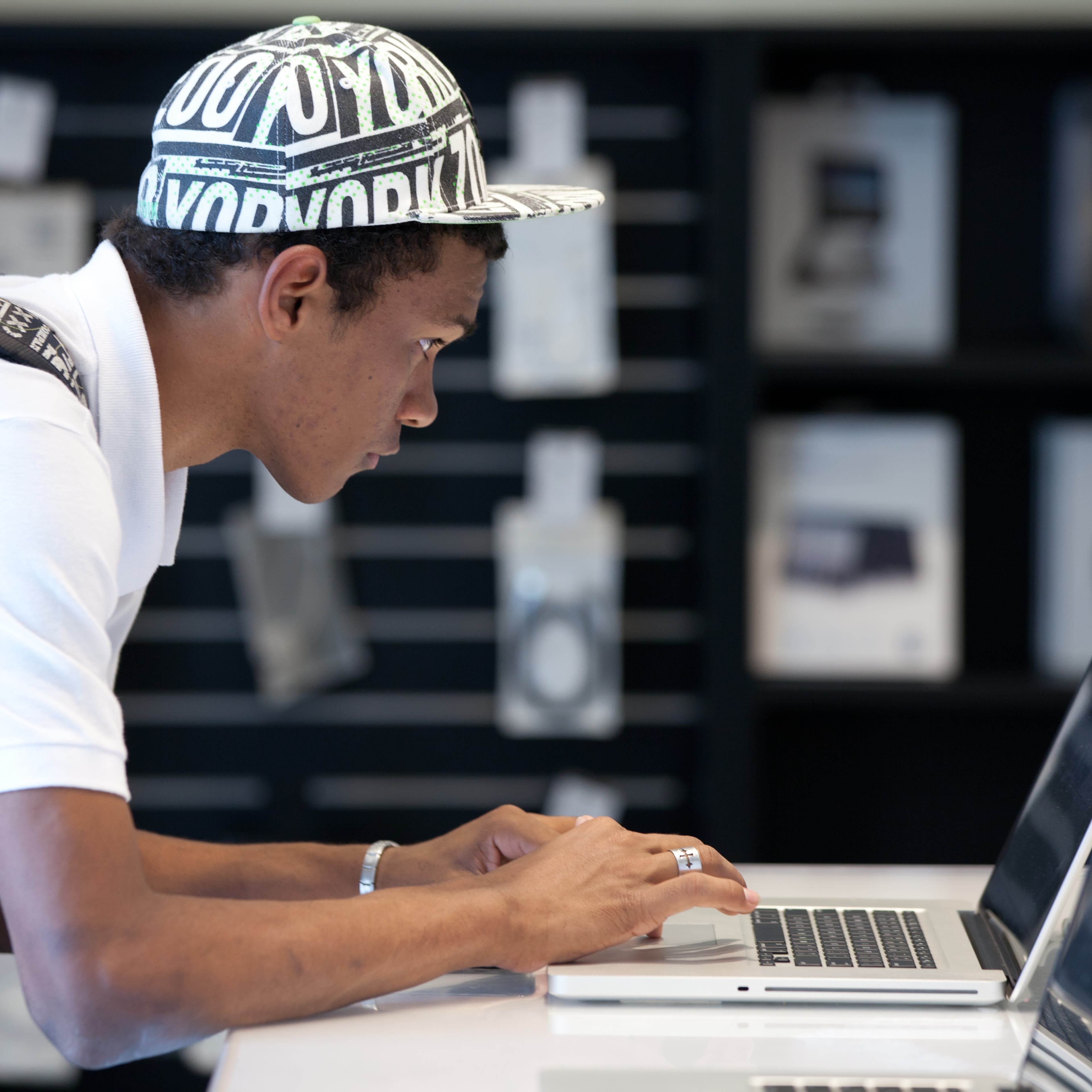A Brazilian man looks at Apple's Macbook