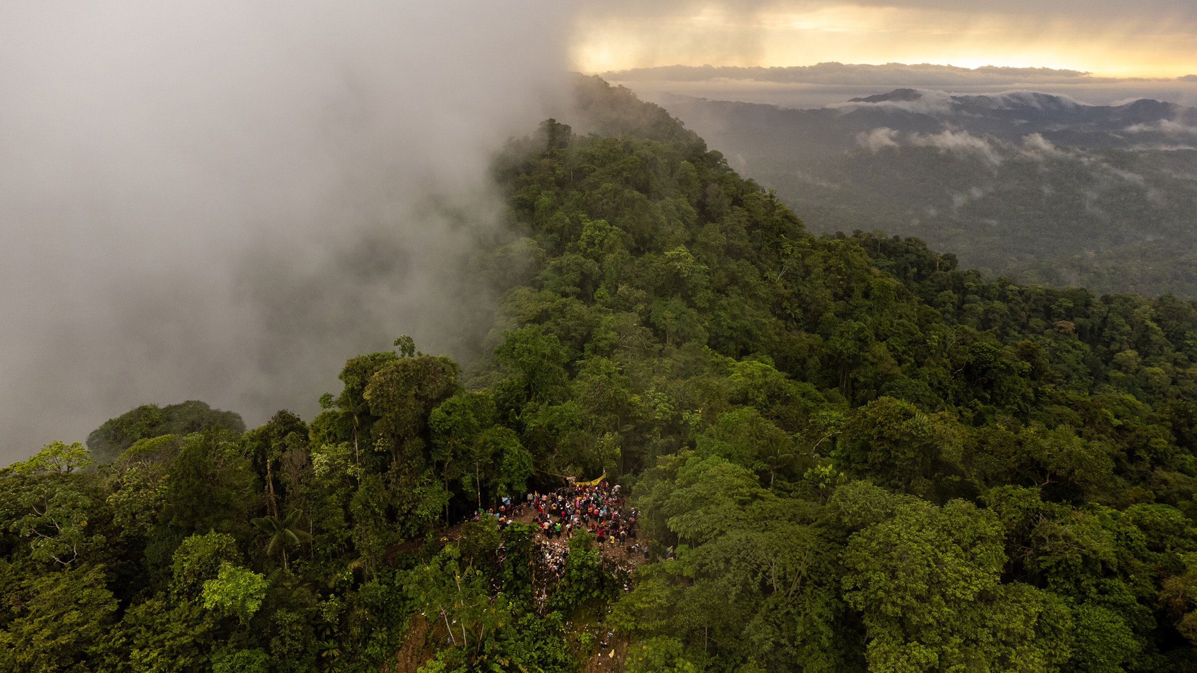 Migrants prepare to cross the Panama border in the Darién Gap in Colombia, on Aug. 3.
