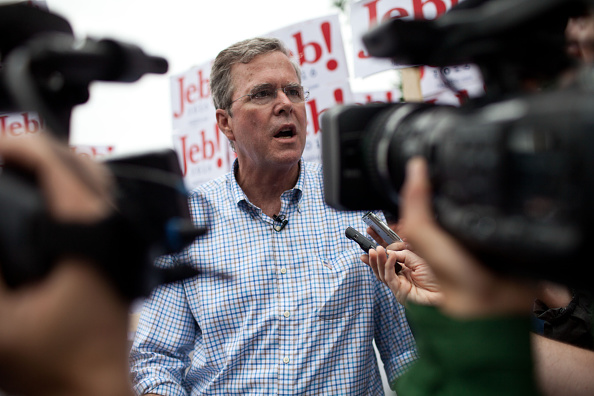 Republican Presidential candidate Jeb Bush speaks to the press at the 4th of July Parade in Merrimack, New Hampshire.