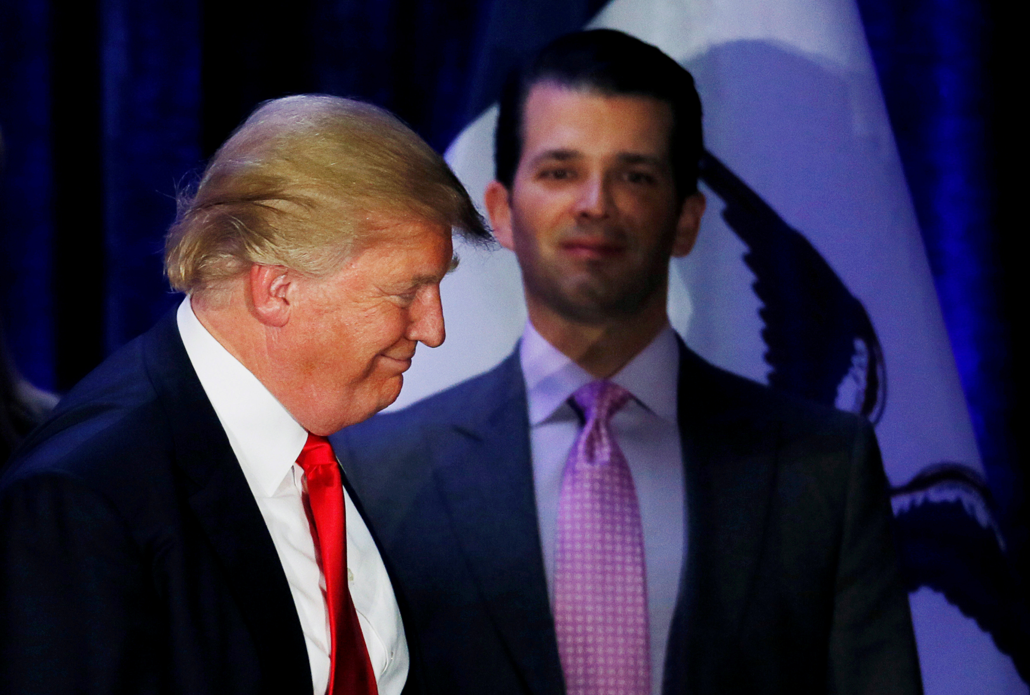 Donald Trump Jr. watches his father Republican U.S. presidential candidate Donald Trump leave the stage on the night of 2016 Iowa Caucus in Des Moines