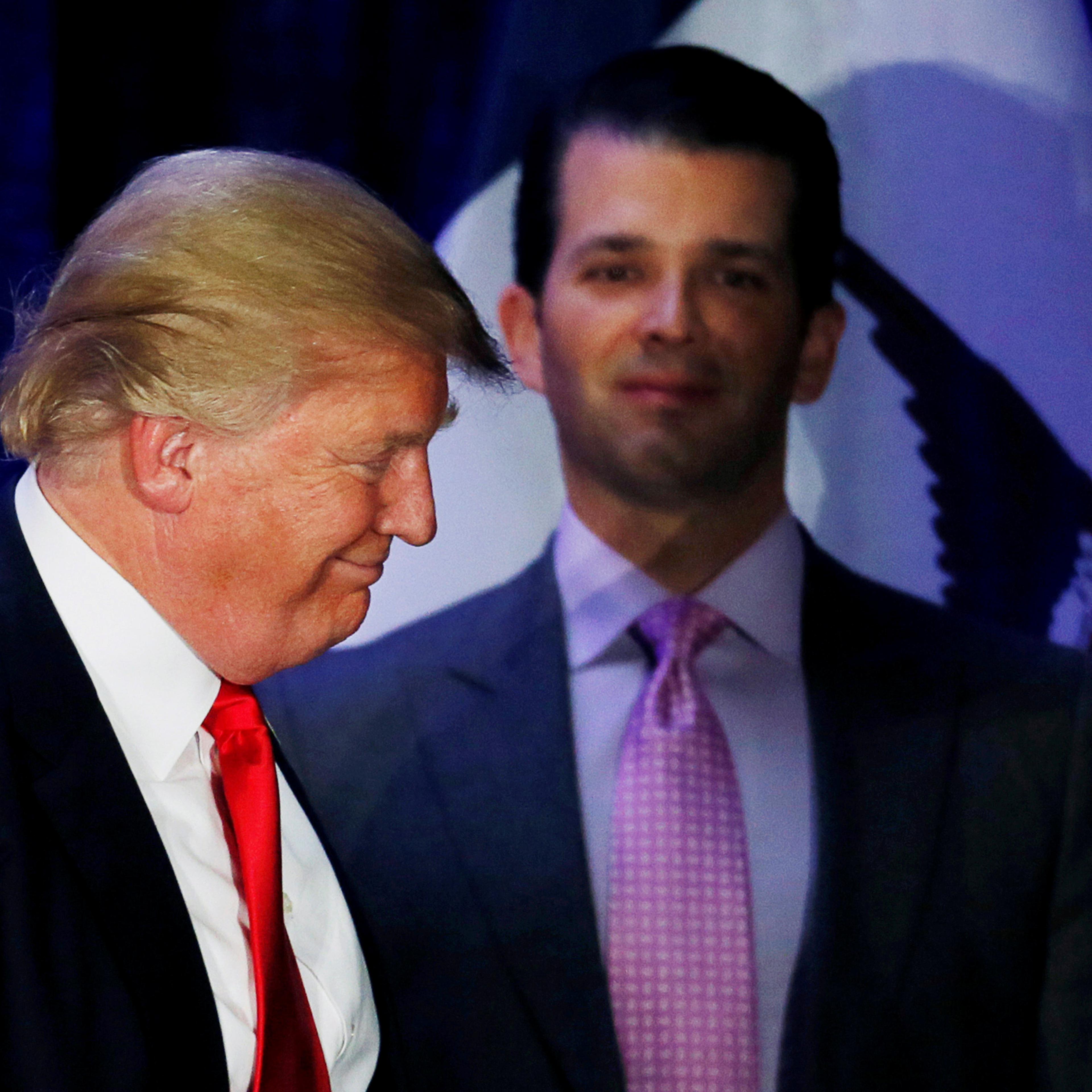 Donald Trump Jr. watches his father Republican U.S. presidential candidate Donald Trump leave the stage on the night of 2016 Iowa Caucus in Des Moines