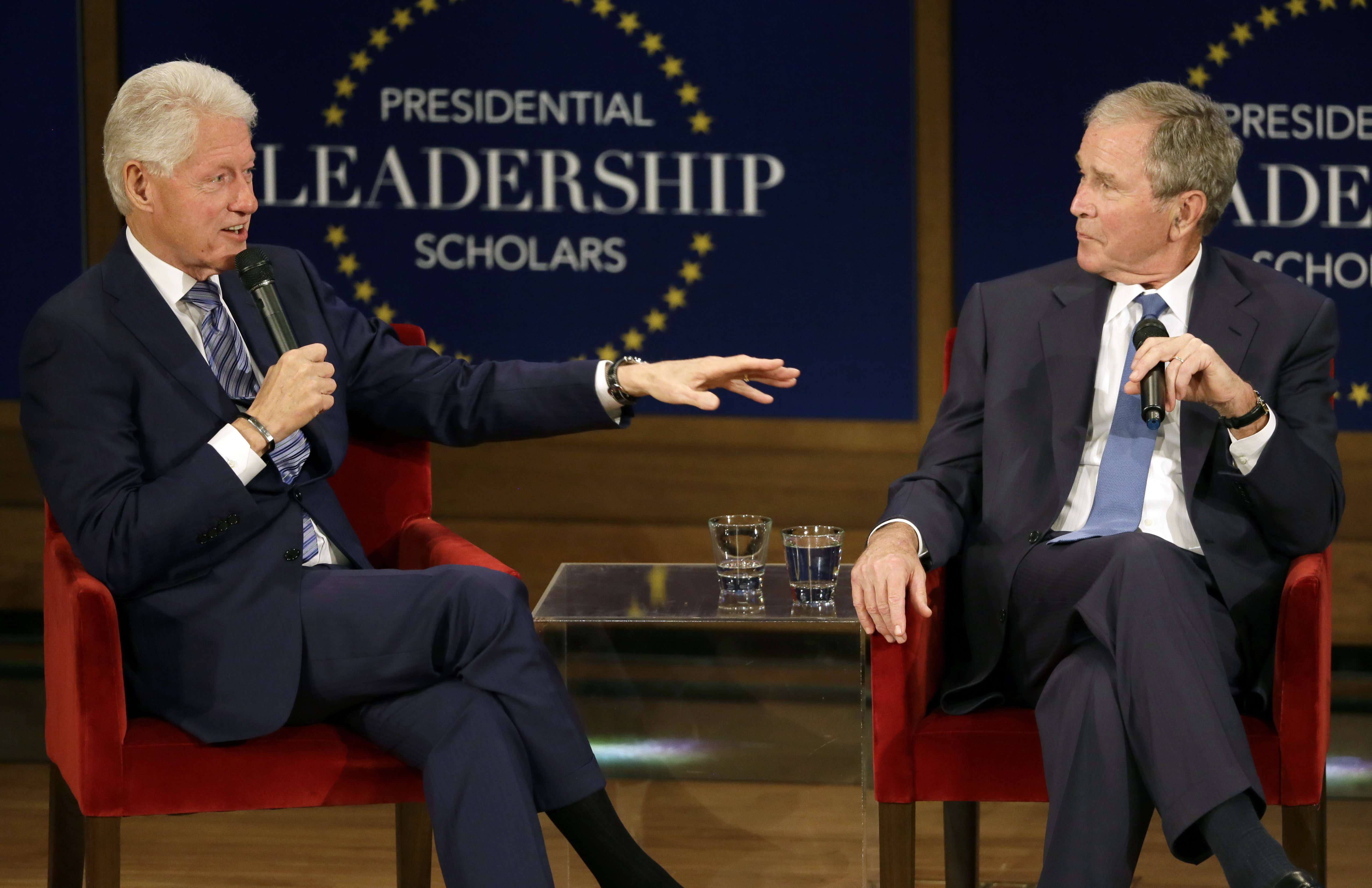 Former Presidents Bill Clinton and George W. Bush participate in a discussion at the Presidential Leadership Scholars graduation ceremony at the George W. Bush Presidential Center, July 13, 2017, in Dallas.
