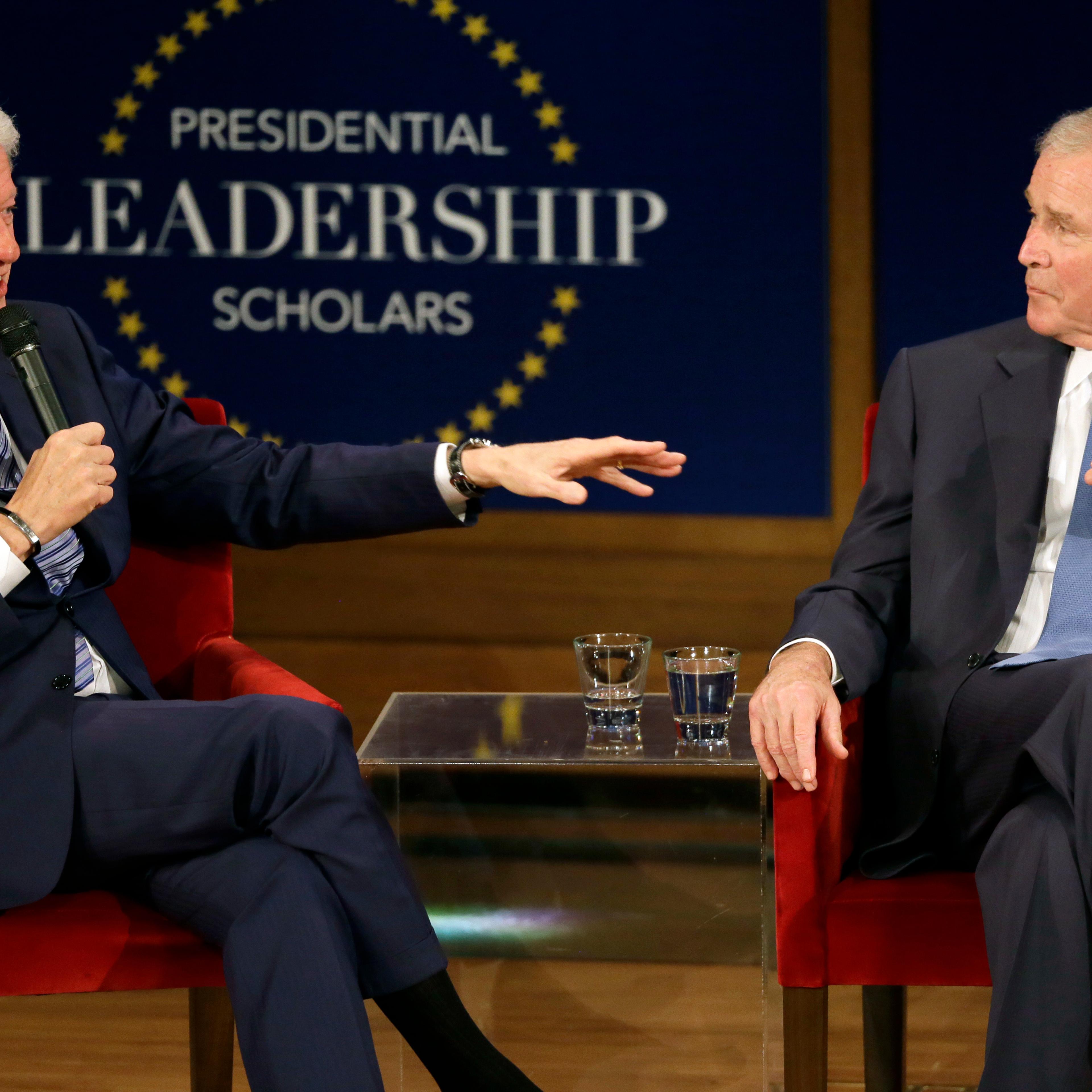 Former Presidents Bill Clinton and George W. Bush participate in a discussion at the Presidential Leadership Scholars graduation ceremony at the George W. Bush Presidential Center, July 13, 2017, in Dallas.