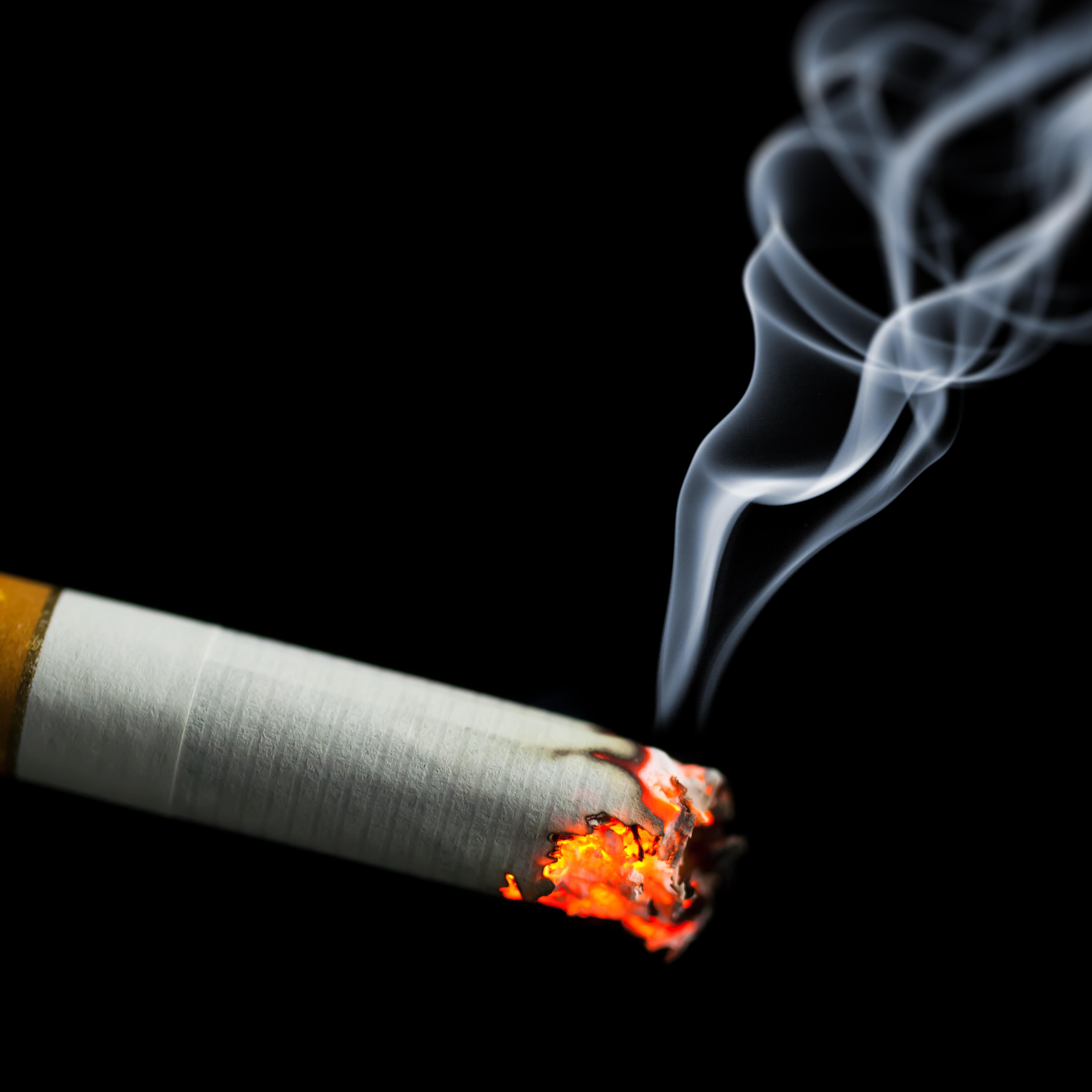 burning cigarette with smoke TIME health stock