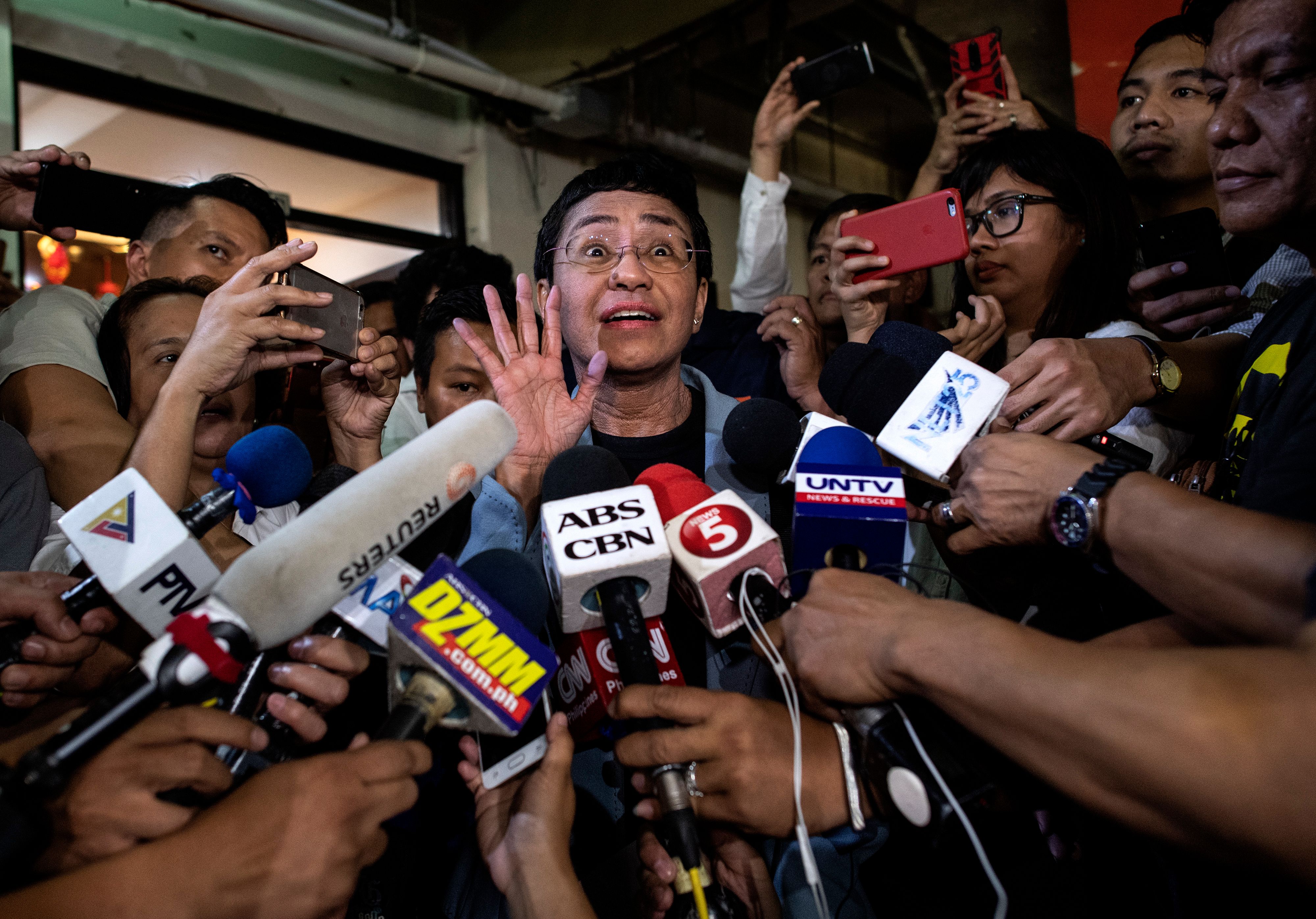 Maria Ressa gives a statement after posting bail in Manila