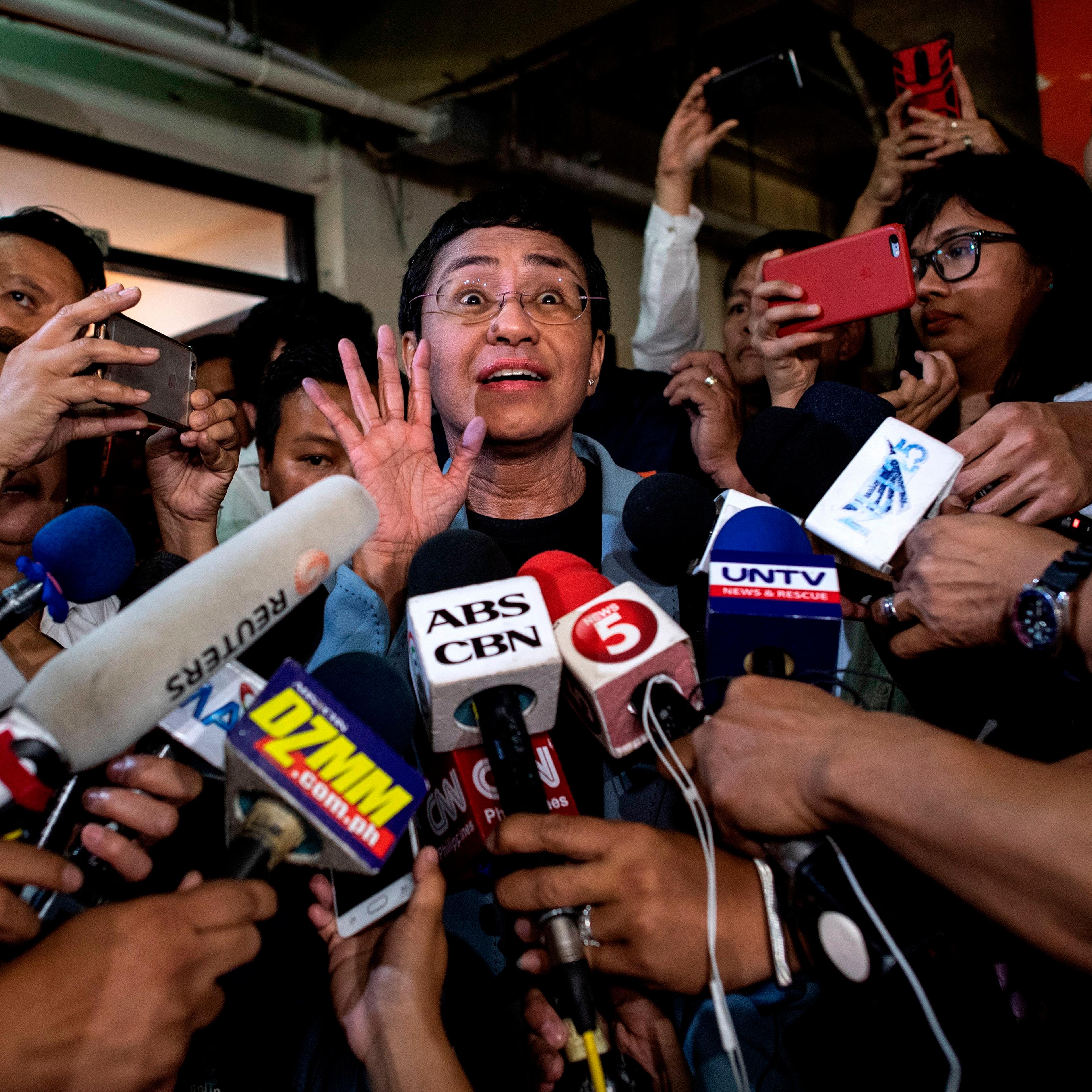 Maria Ressa gives a statement after posting bail in Manila
