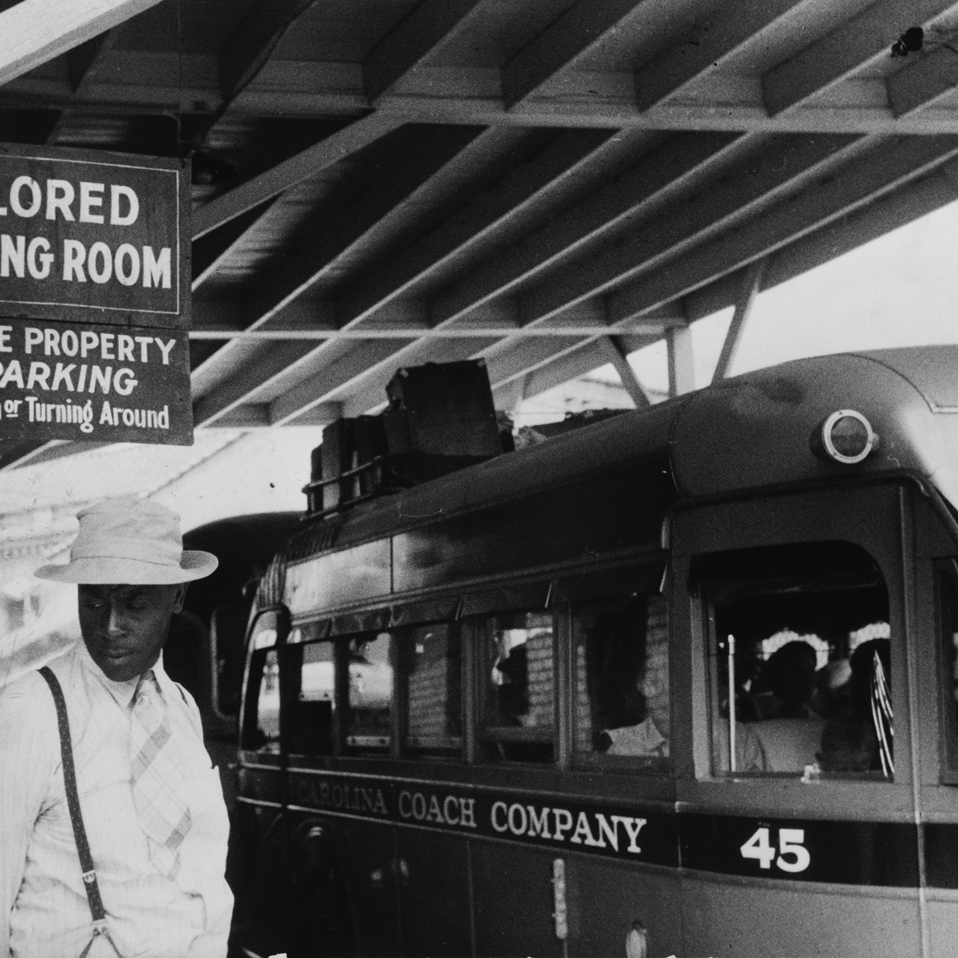 Passengers under a sign that reads “Colored Waiting Room” at a bus station in Durham, N.C., in 1940