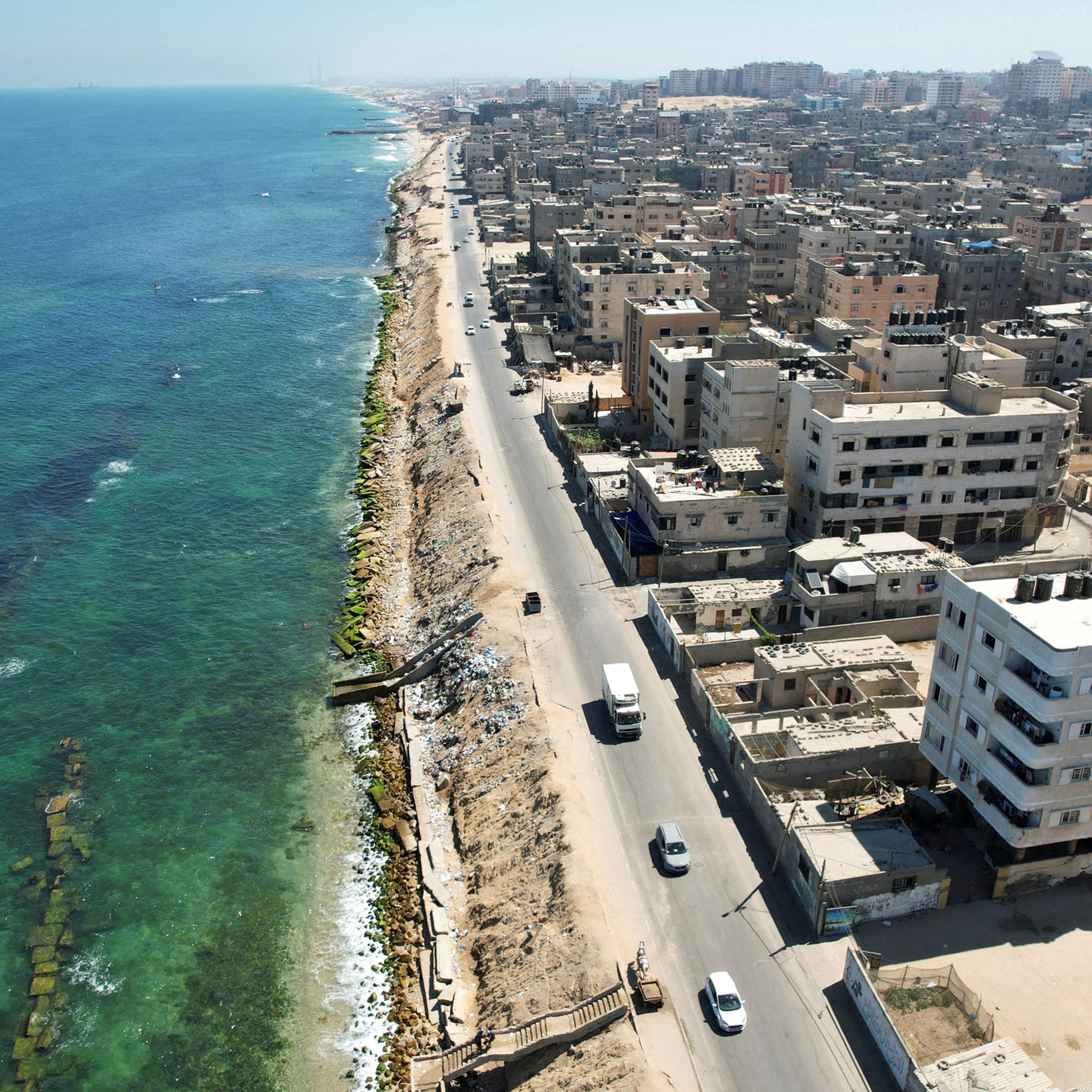 A view of Beach refugee camp shows the erosion of the shore and new vertical wave breakers placed inside the sea in Gaza City on July 26, 2022.