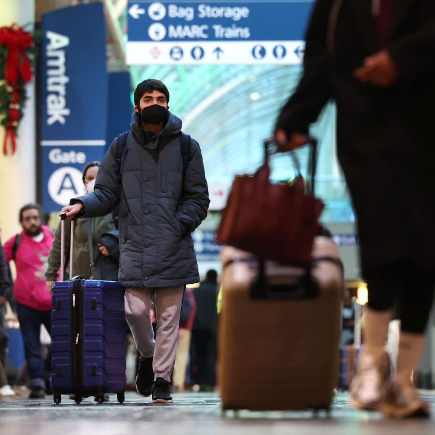 A traveler wearing a mask to protect against COVID-19