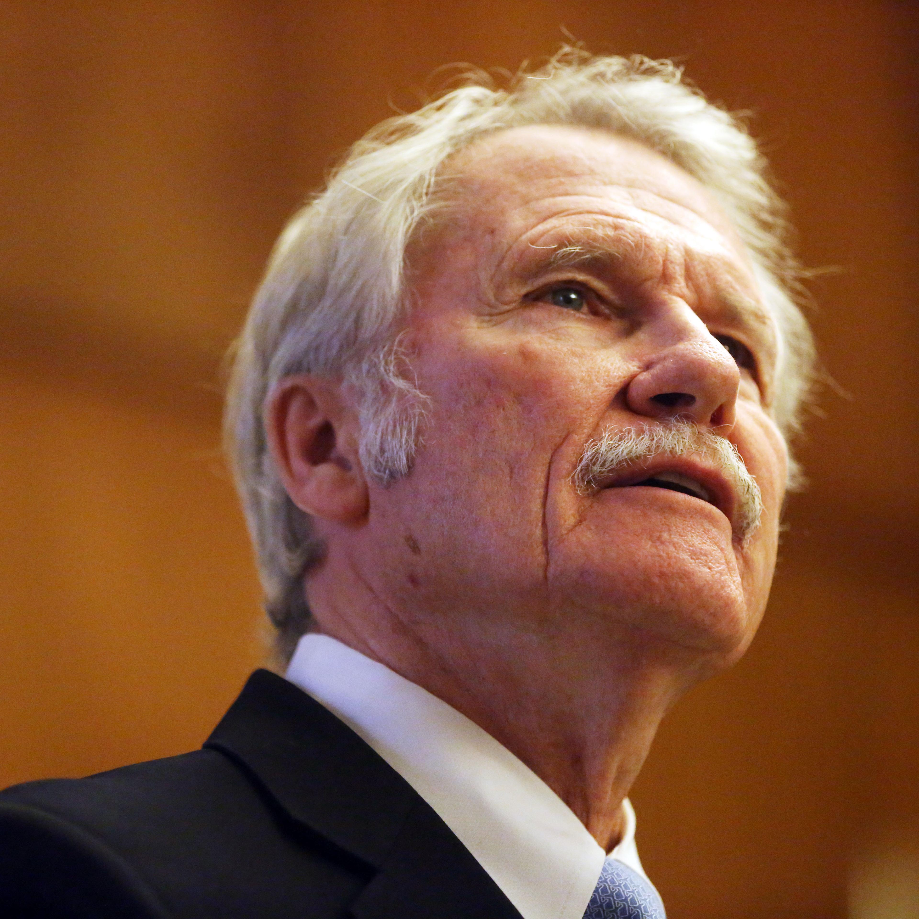 Gov. John Kitzhaber speaks to the media as he presents his two-year state budget proposal from his ceremonial office at the State Capitol in Salem, Ore., on Dec. 1, 2014.