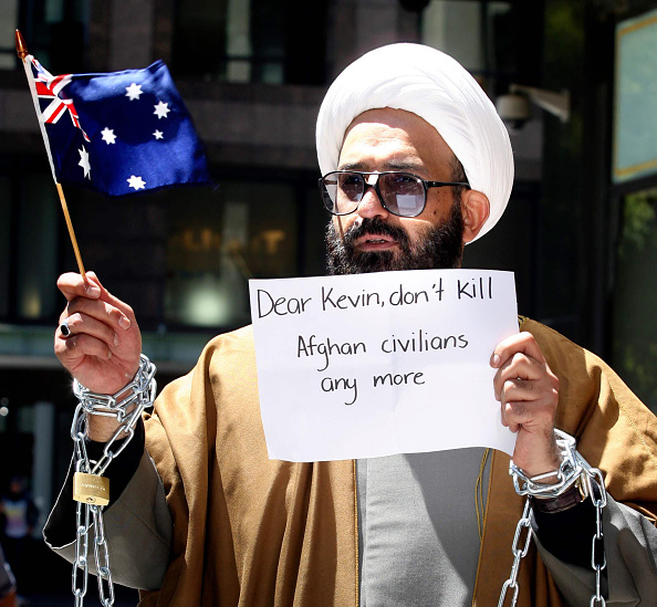 November 10, 2009: Sydney, NSW. Iranian born Muslim cleric, Sheik Haron, who is named in court papers as Man Haron Monis, chained to a railing outside the Downing Centre Court in Sydney in an anti-war protest. He had appeared in court to face charges of 